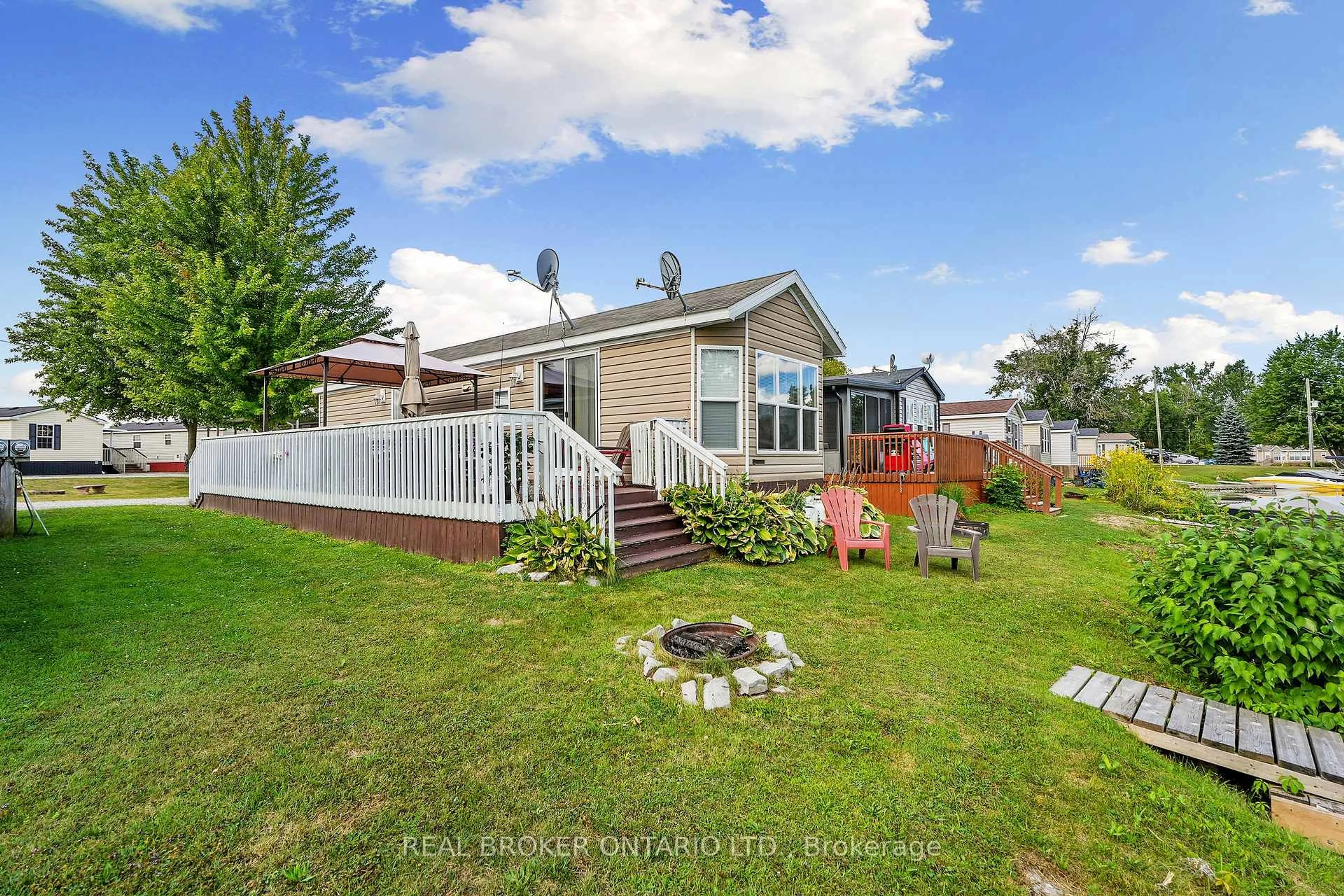 A pic from outside/outdoor area/front of a property/back of a property/a pic from drone, unknown for 171 Woodland Estate Rd #CPC7, Trent Hills Ontario K0L 1L0