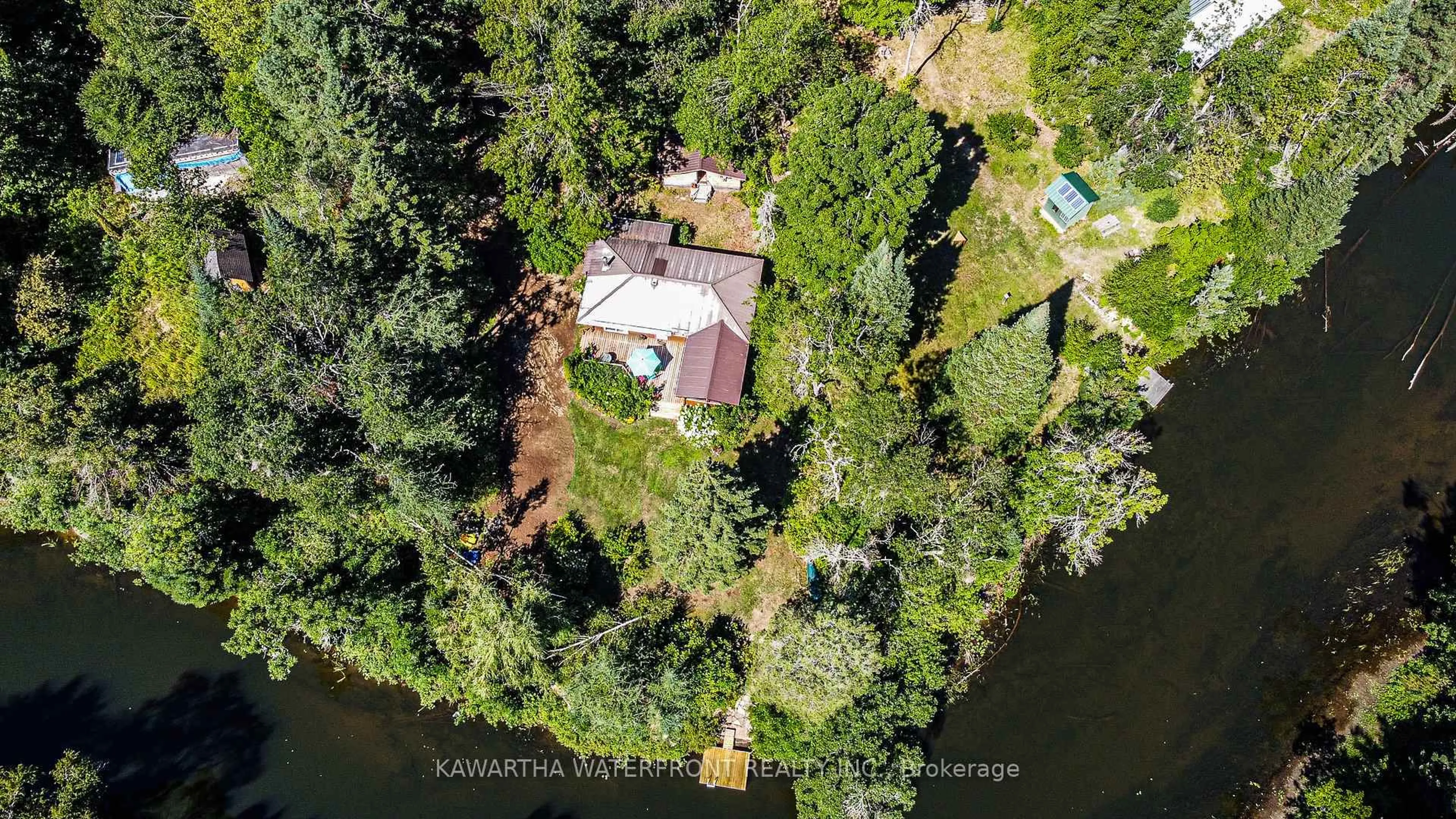 A pic from outside/outdoor area/front of a property/back of a property/a pic from drone, water/lake/river/ocean view for 1025 Nystedt Lane, Minden Hills Ontario K0M 2A1