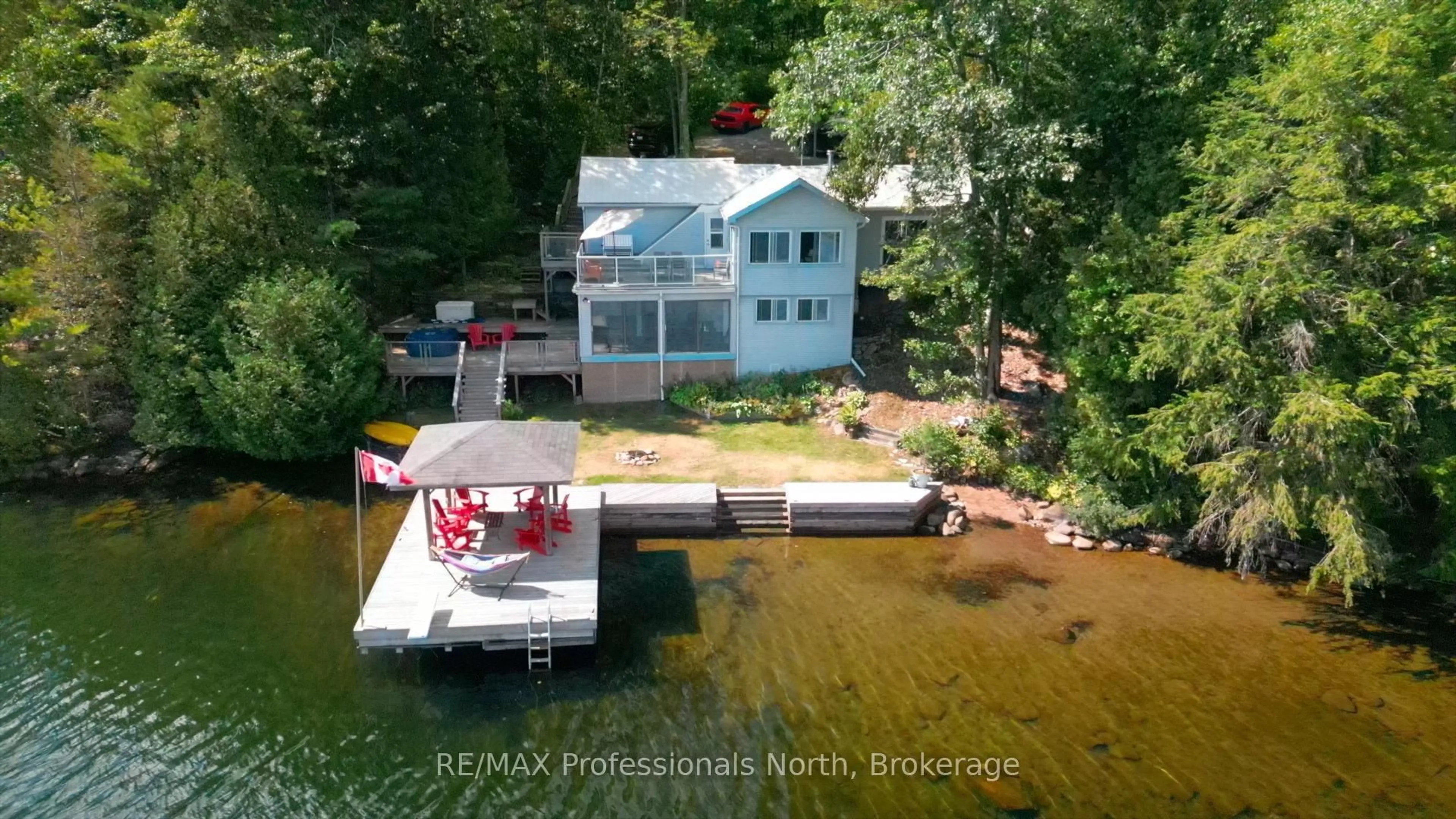 A pic from outside/outdoor area/front of a property/back of a property/a pic from drone, water/lake/river/ocean view for 1272 Grierson Tr, Minden Hills Ontario K0M 2K0