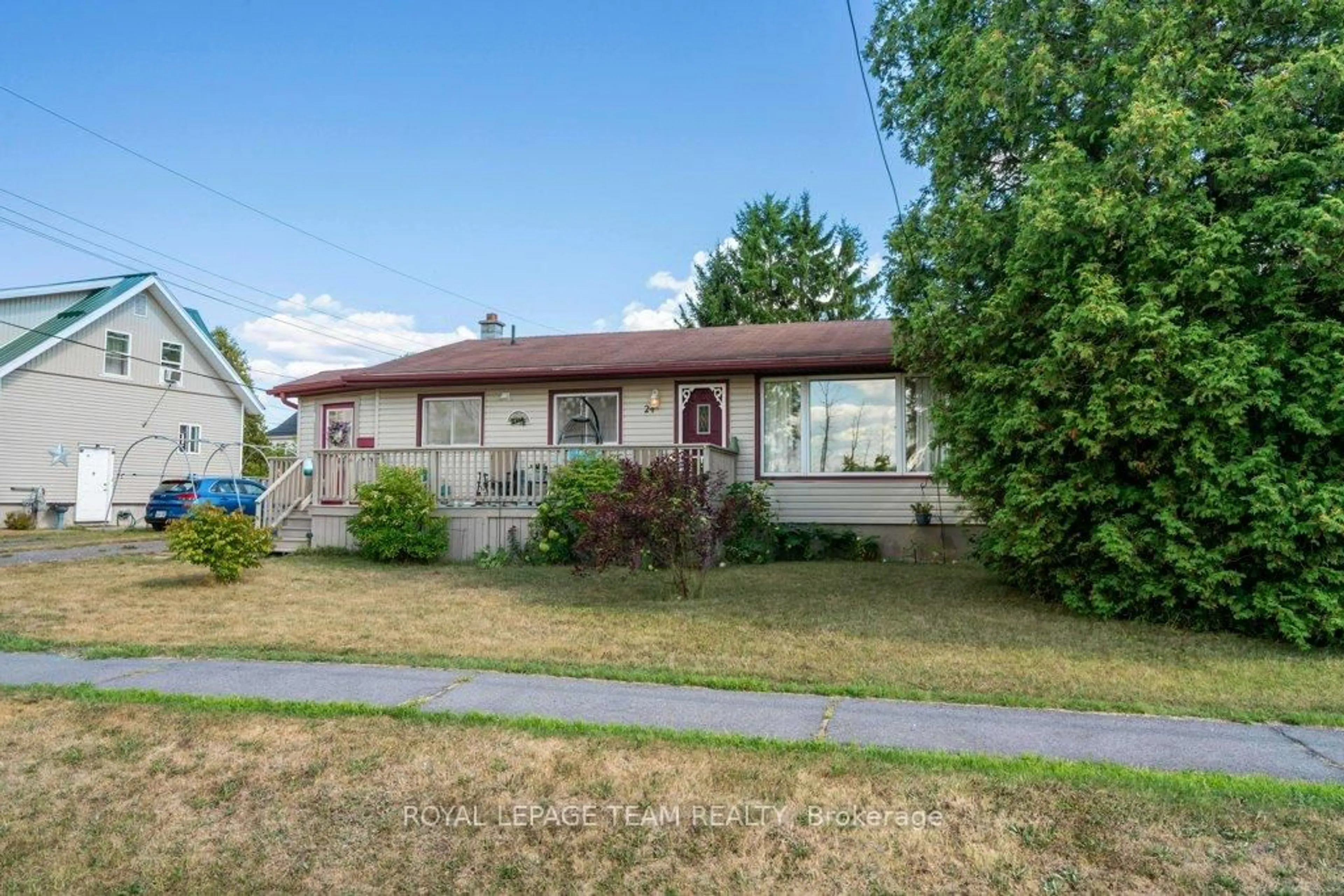 Home with vinyl exterior material, street for 24 Beach Ave, South Dundas Ontario K0E 1K0