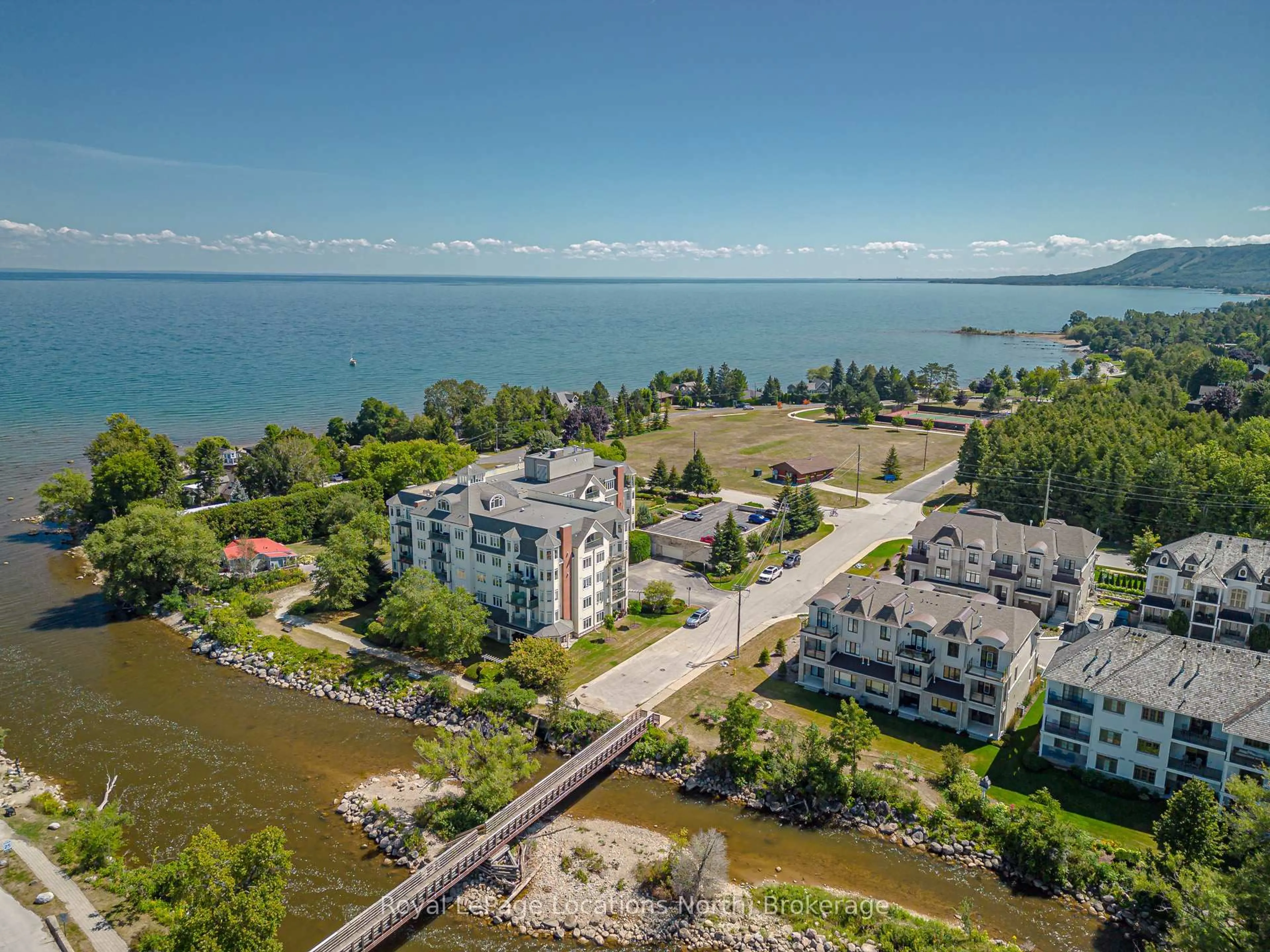 A pic from outside/outdoor area/front of a property/back of a property/a pic from drone, water/lake/river/ocean view for 10 Bay St #207, Blue Mountains Ontario N0H 2P0