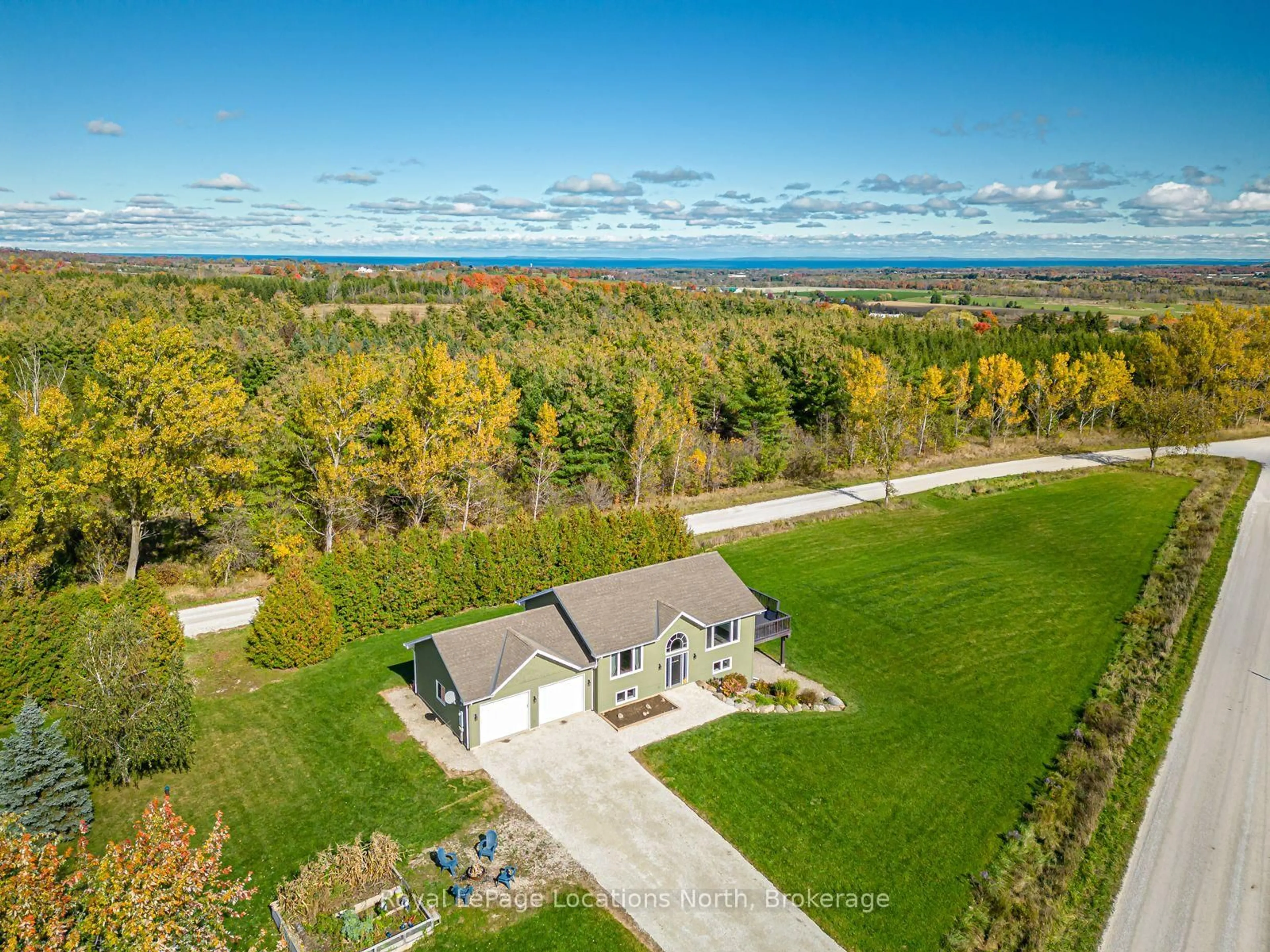 A pic from outside/outdoor area/front of a property/back of a property/a pic from drone, water/lake/river/ocean view for 807151 25 Sdrd, Grey Highlands Ontario N0H 1N0