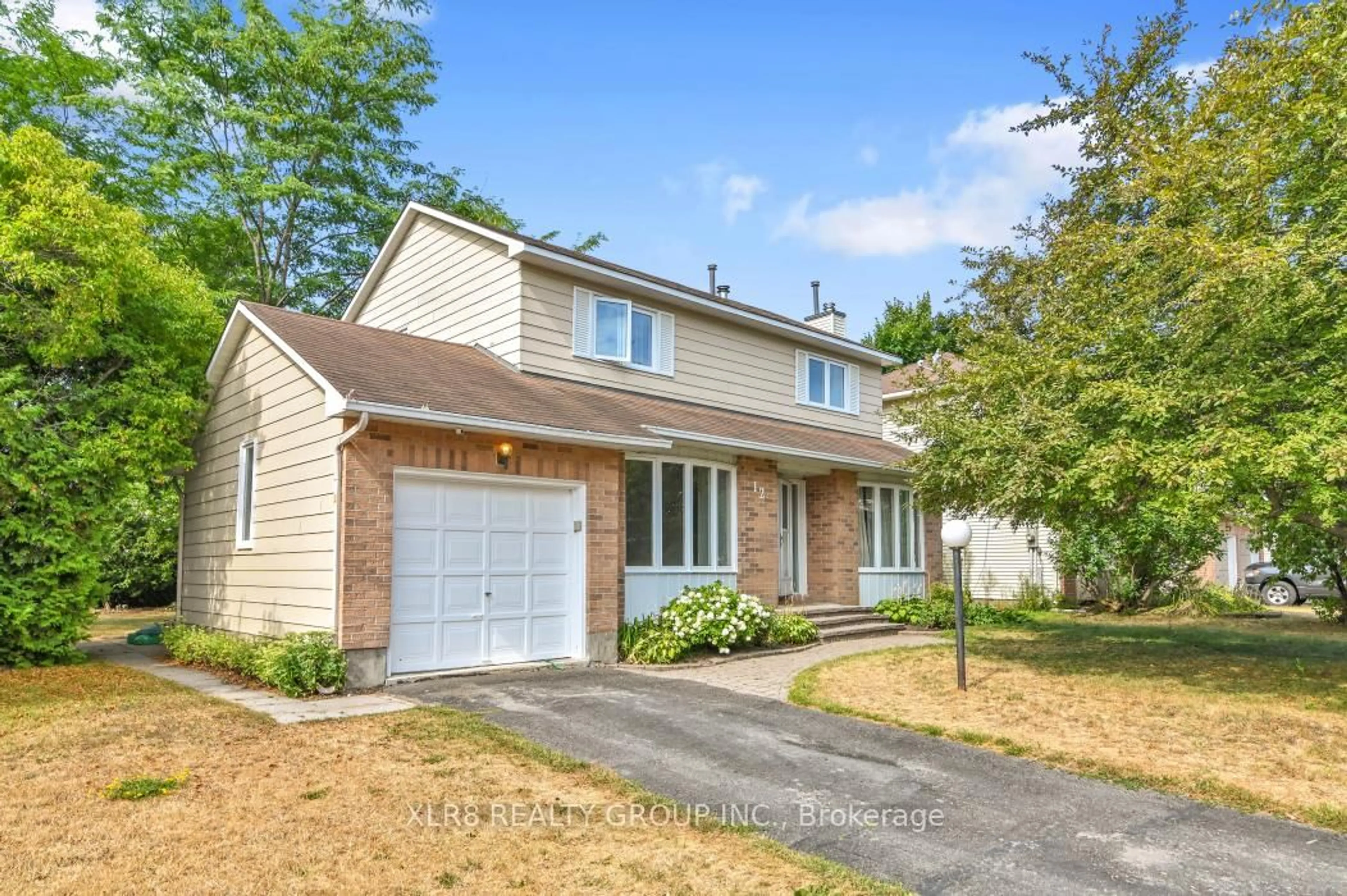 Home with vinyl exterior material, street for 12 John Sidney Cres, Ottawa Ontario K2S 1J7