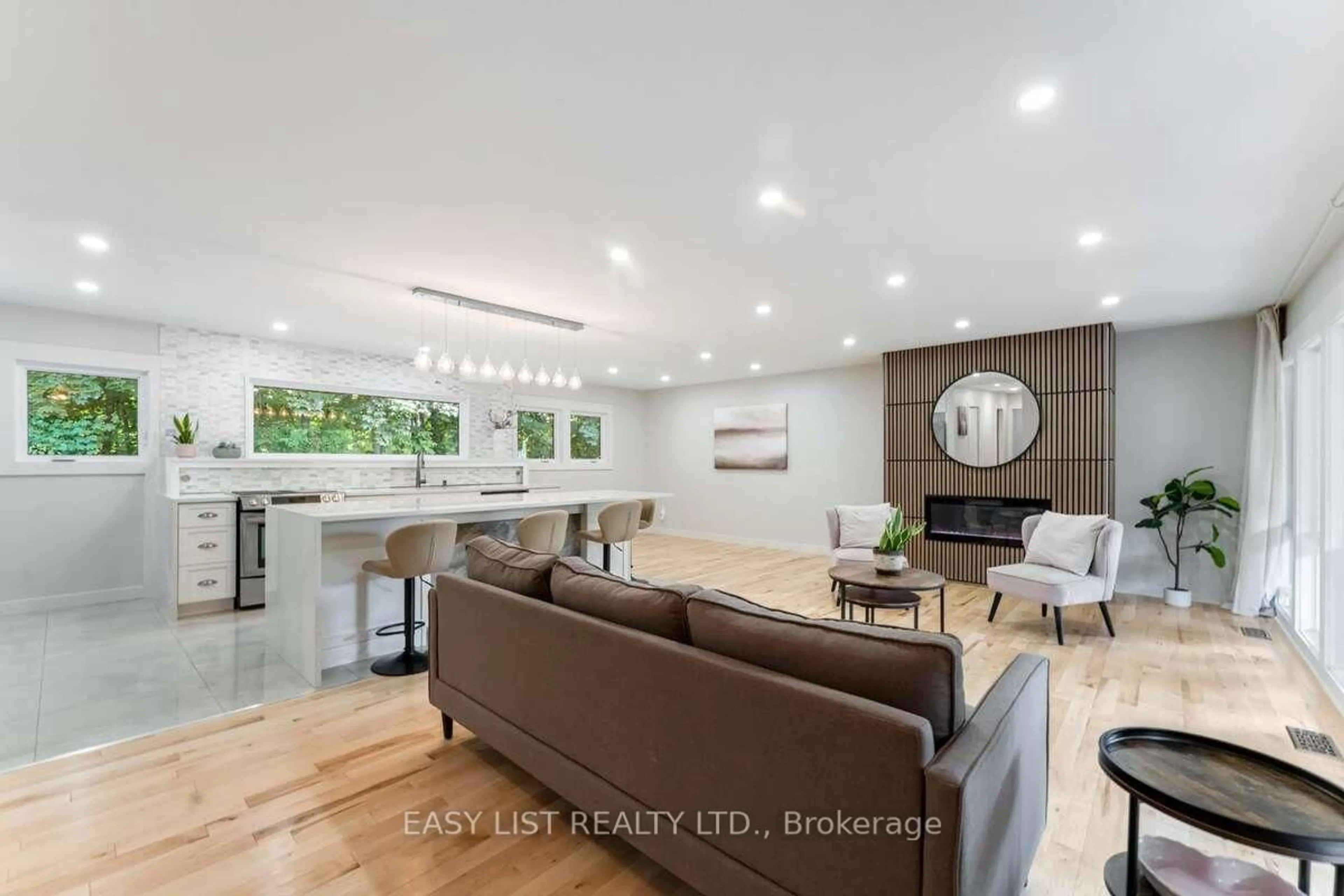 Living room with furniture, wood/laminate floor for 15 Leacock Dr, Ottawa Ontario K2K 1R6