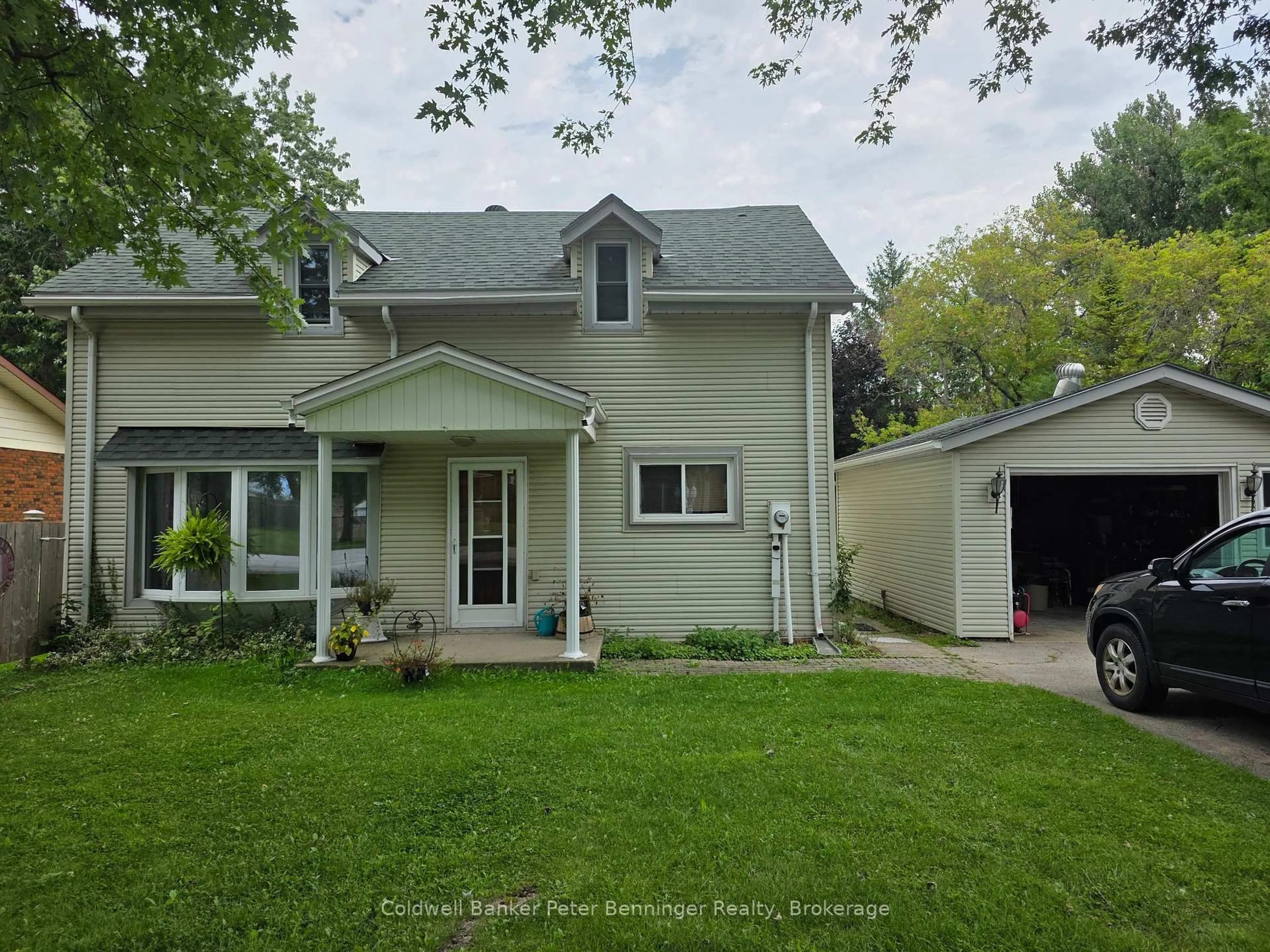 Home with vinyl exterior material, street for 233 Queen St, Arran-Elderslie Ontario N0G 2N0