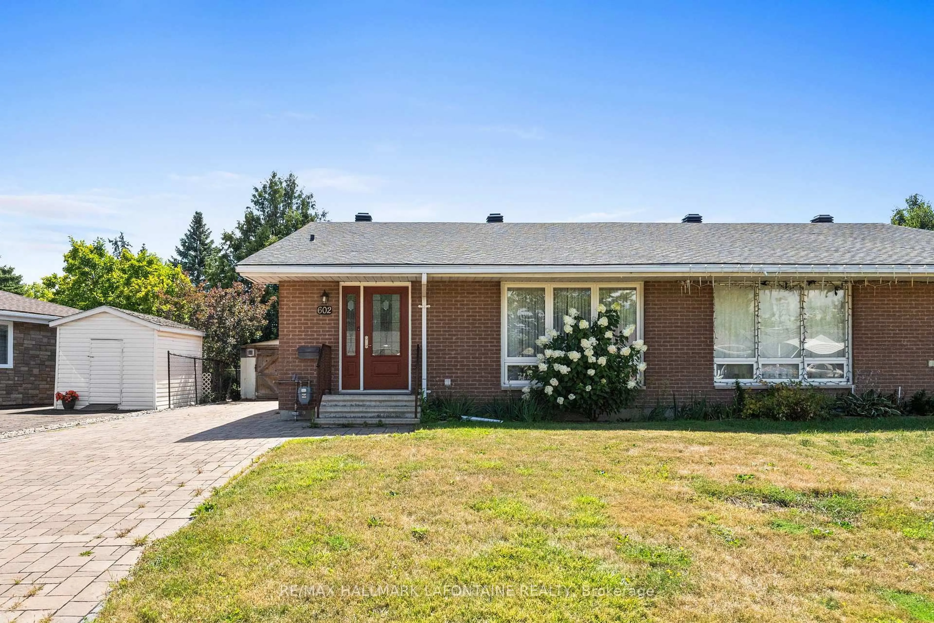 Home with brick exterior material, street for 602 Eastvale Dr, Ottawa Ontario K1J 6Z6