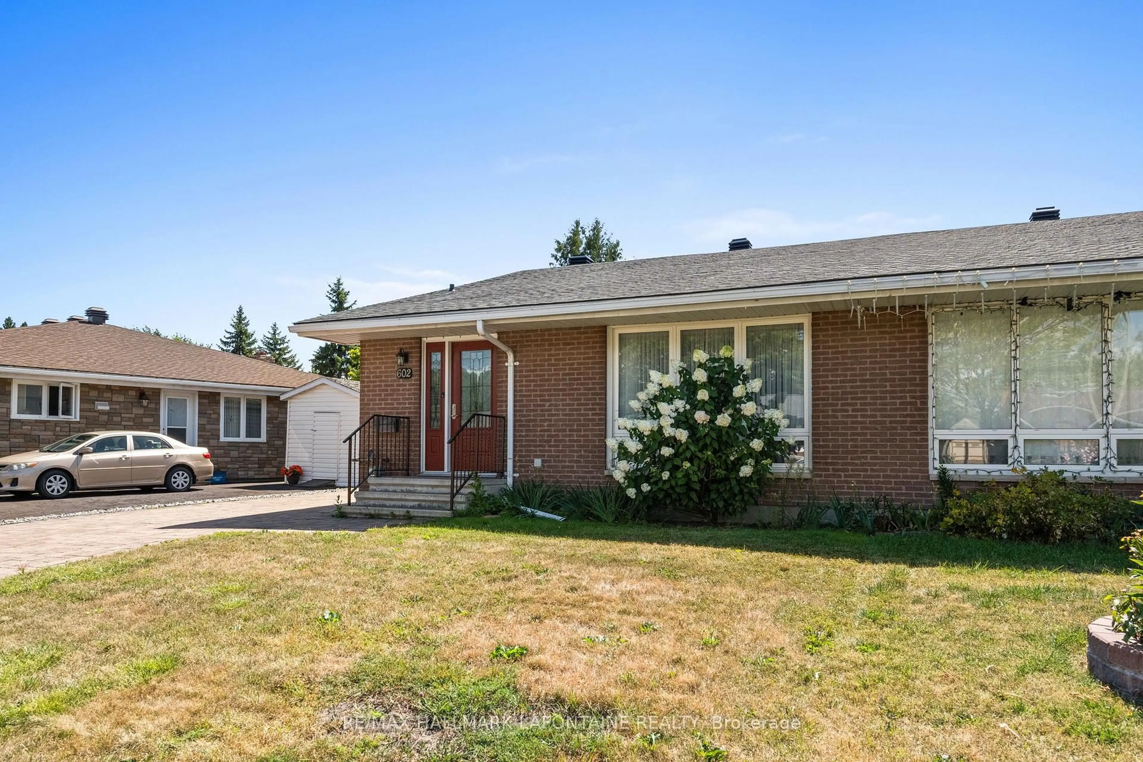 Home with brick exterior material, street for 602 Eastvale Dr, Ottawa Ontario K1J 6Z6