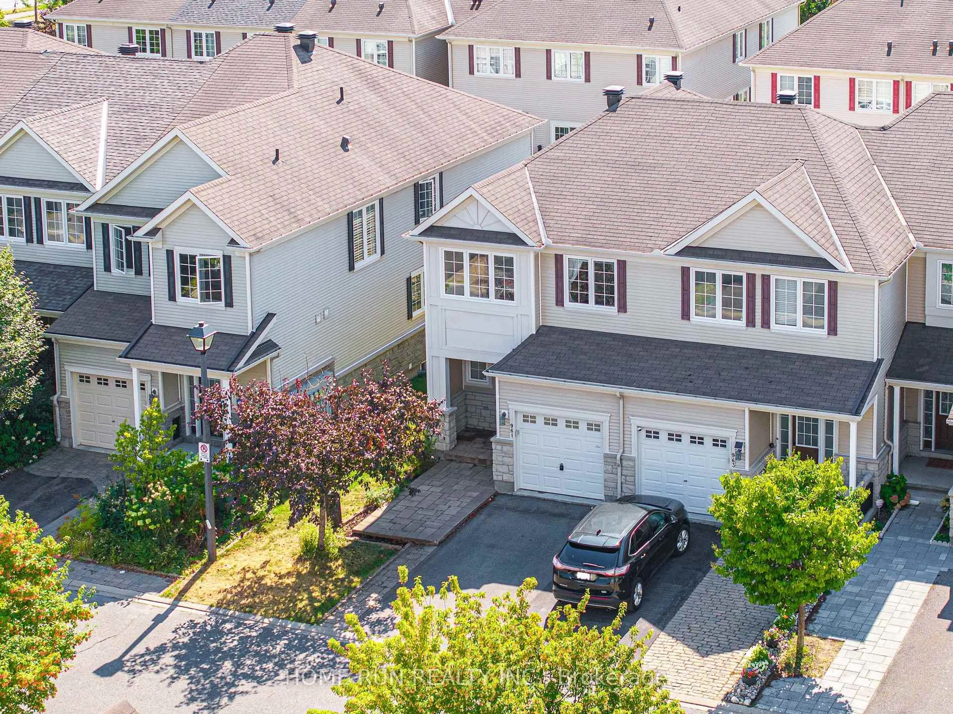 A pic from outside/outdoor area/front of a property/back of a property/a pic from drone, street for 961 Caldermill Private, Ottawa Ontario K2J 0Z7