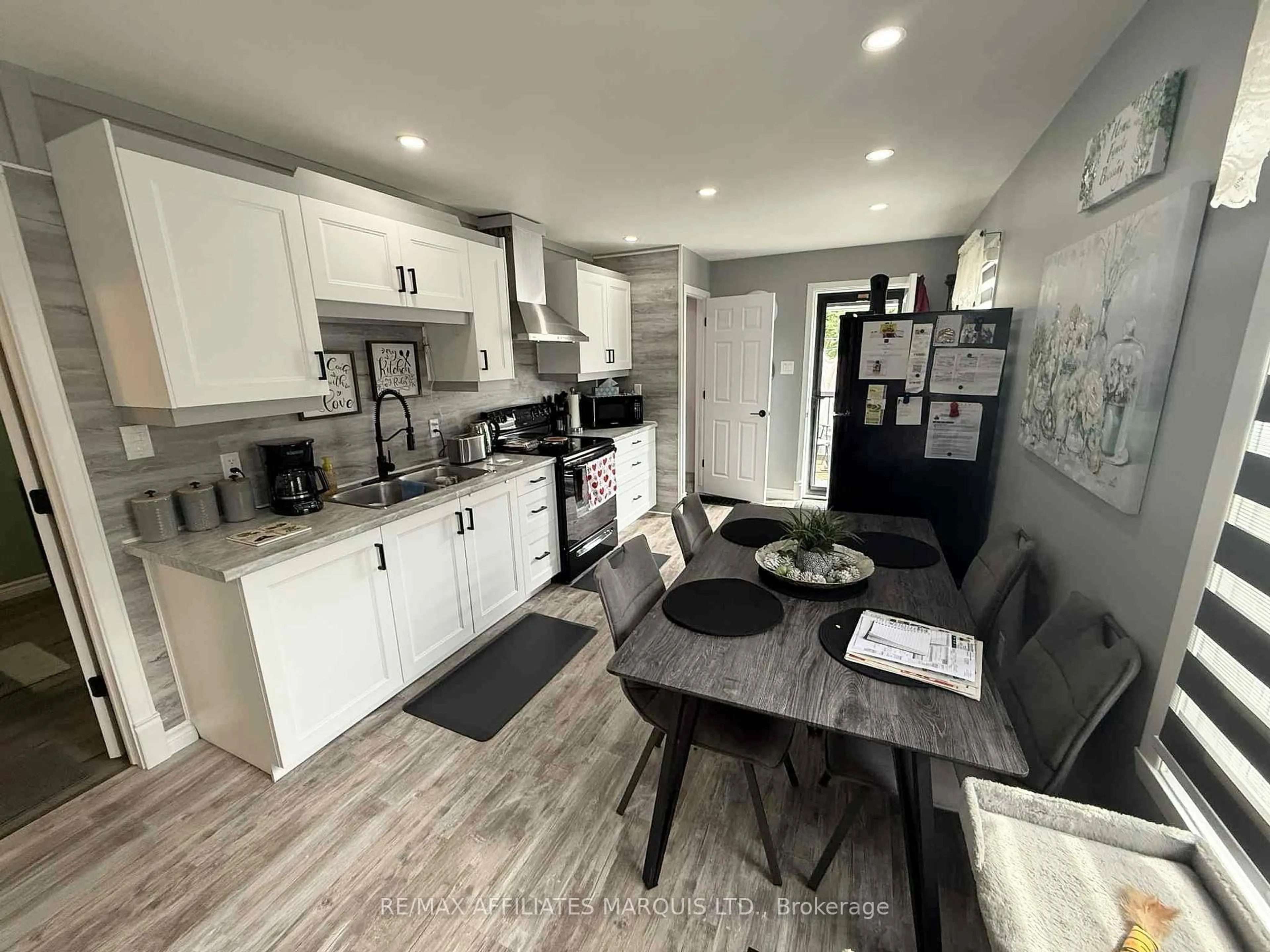 Open concept kitchen, wood/laminate floor for 29 Seymour Ave, Cornwall Ontario K6J 4L9