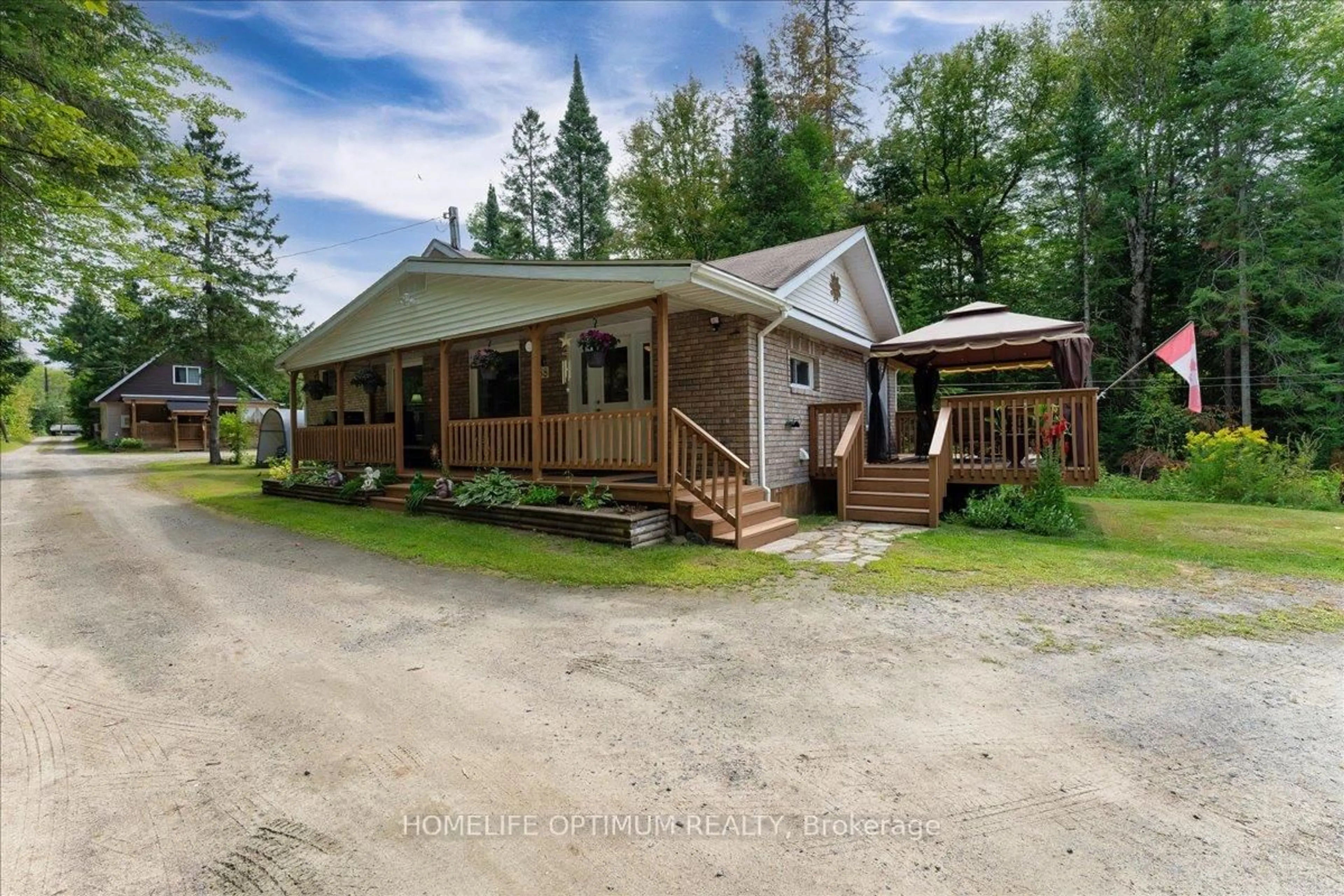 A pic from outside/outdoor area/front of a property/back of a property/a pic from drone, unknown for 788 Muskoka Rd. 3 Rd, Huntsville Ontario P1H 1E1