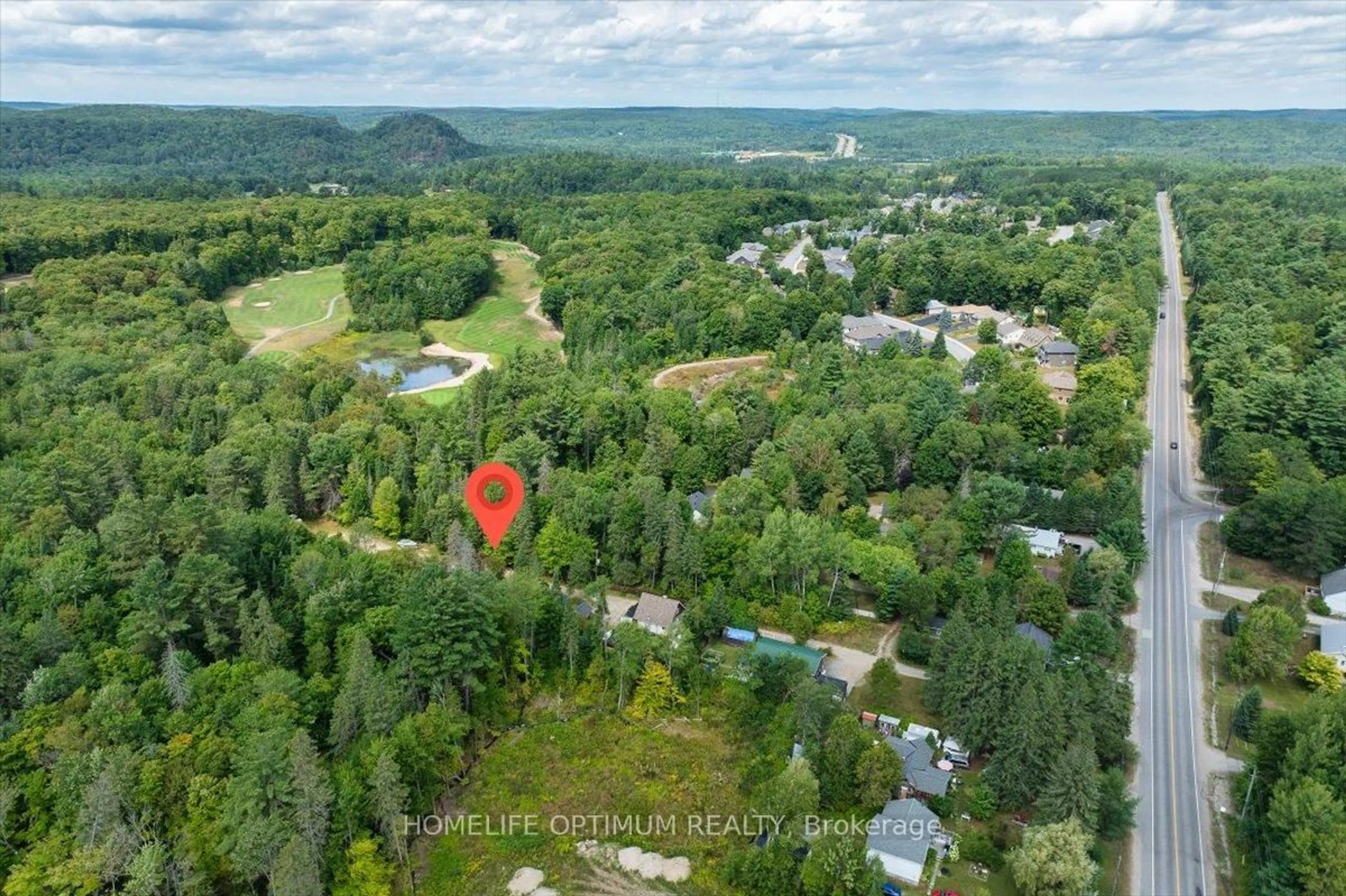 A pic from outside/outdoor area/front of a property/back of a property/a pic from drone, forest/trees view for 788 Muskoka Rd. 3 Rd, Huntsville Ontario P1H 1E1