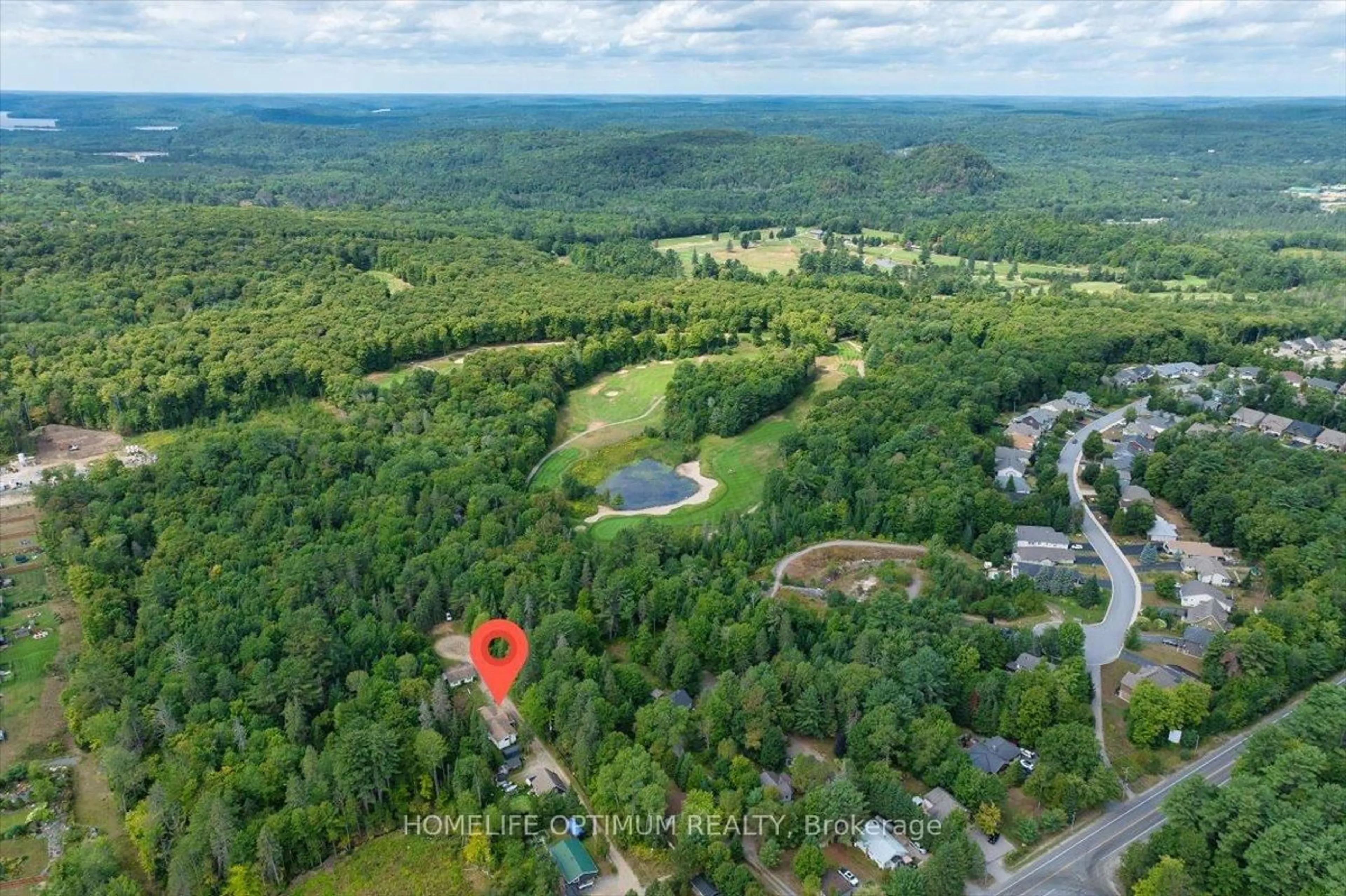 A pic from outside/outdoor area/front of a property/back of a property/a pic from drone, forest/trees view for 788 Muskoka Rd. 3 Rd, Huntsville Ontario P1H 1E1