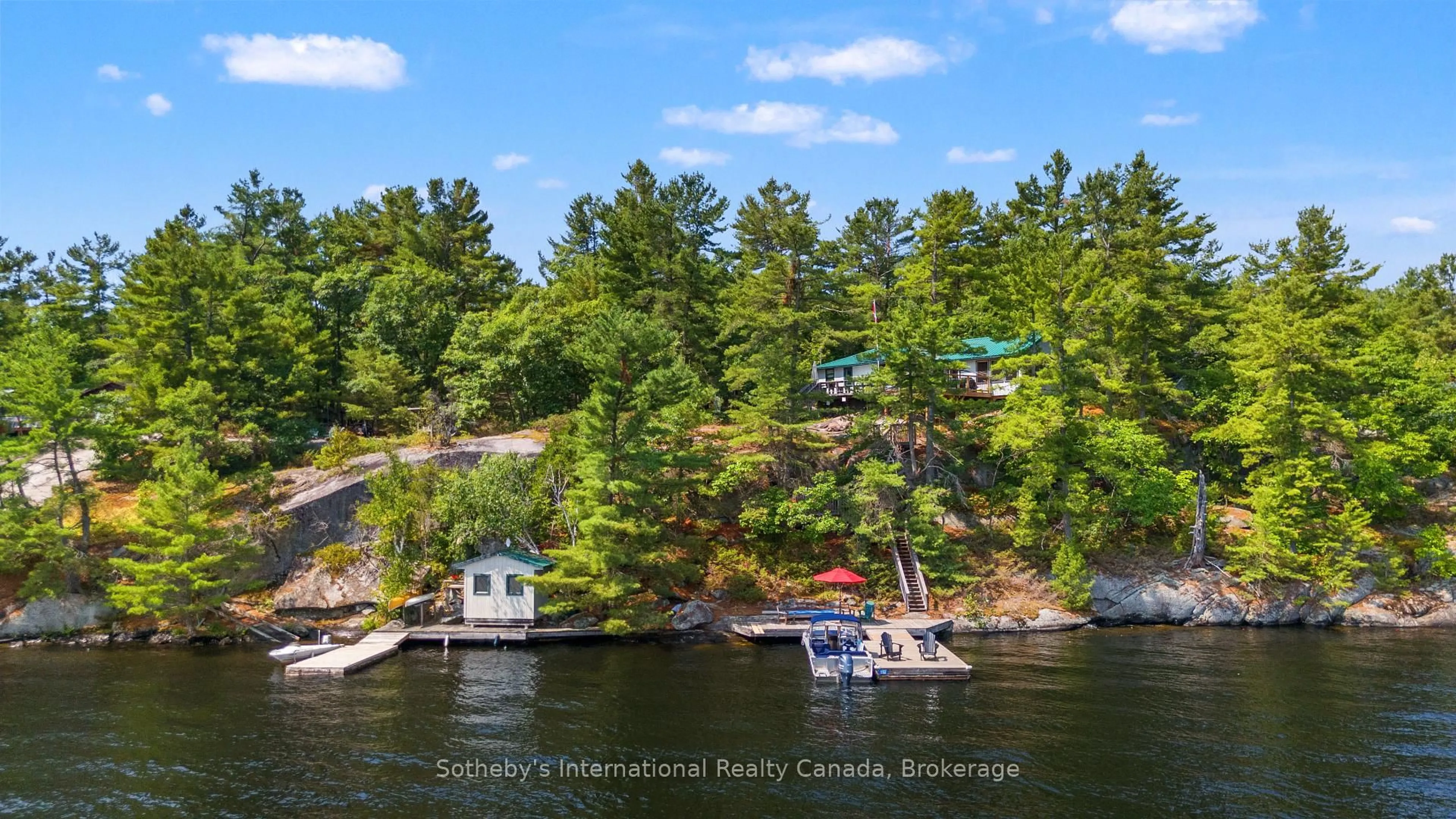 A pic from outside/outdoor area/front of a property/back of a property/a pic from drone, water/lake/river/ocean view for 552 Is 80 Go Home Lake, Georgian Bay Ontario P0C 1H0
