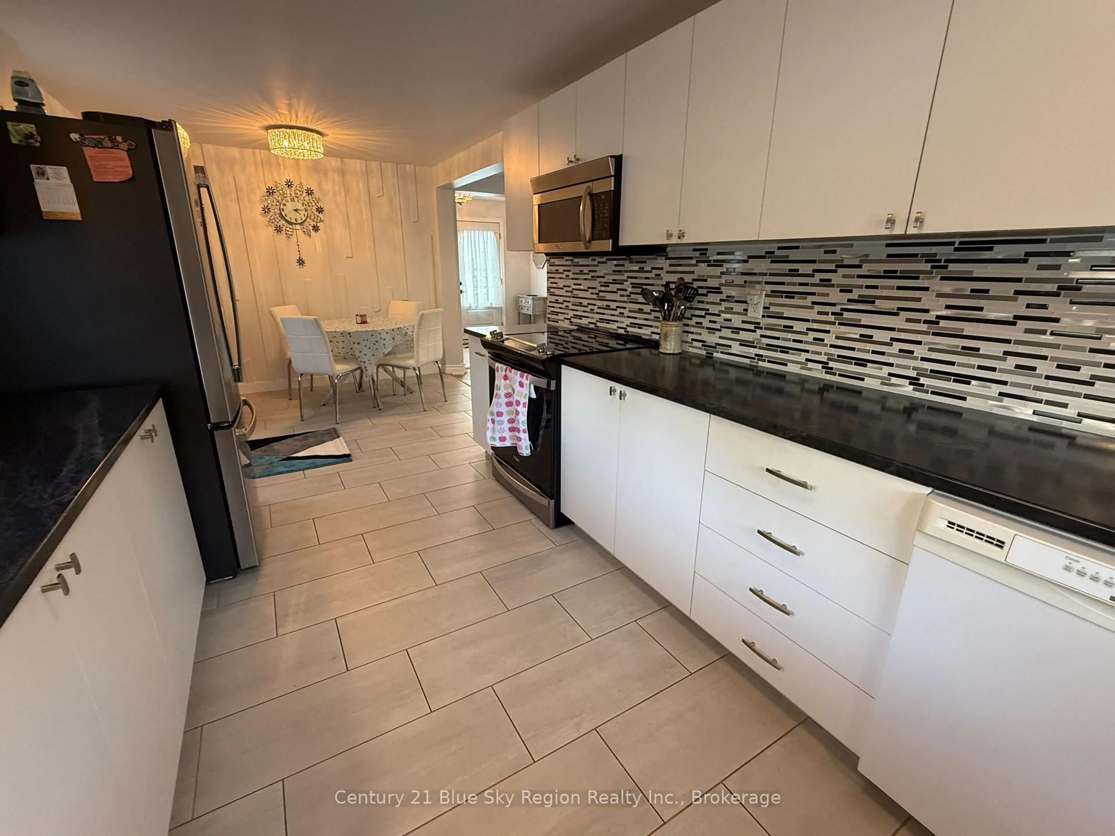 Open concept kitchen, ceramic/tile floor for 71 Swale St, Callander Ontario P0H 1H0