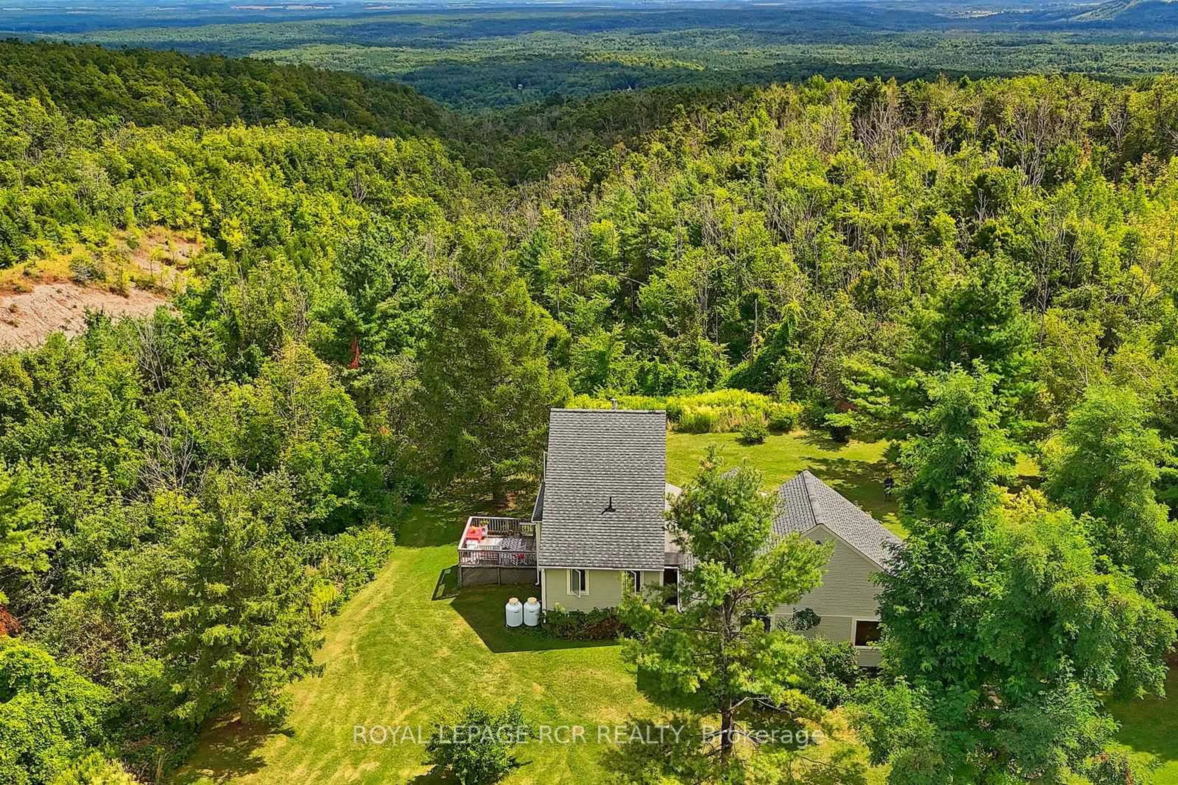 A pic from outside/outdoor area/front of a property/back of a property/a pic from drone, forest/trees view for 798433 3rd Line, Mulmur Ontario L9V 0H8