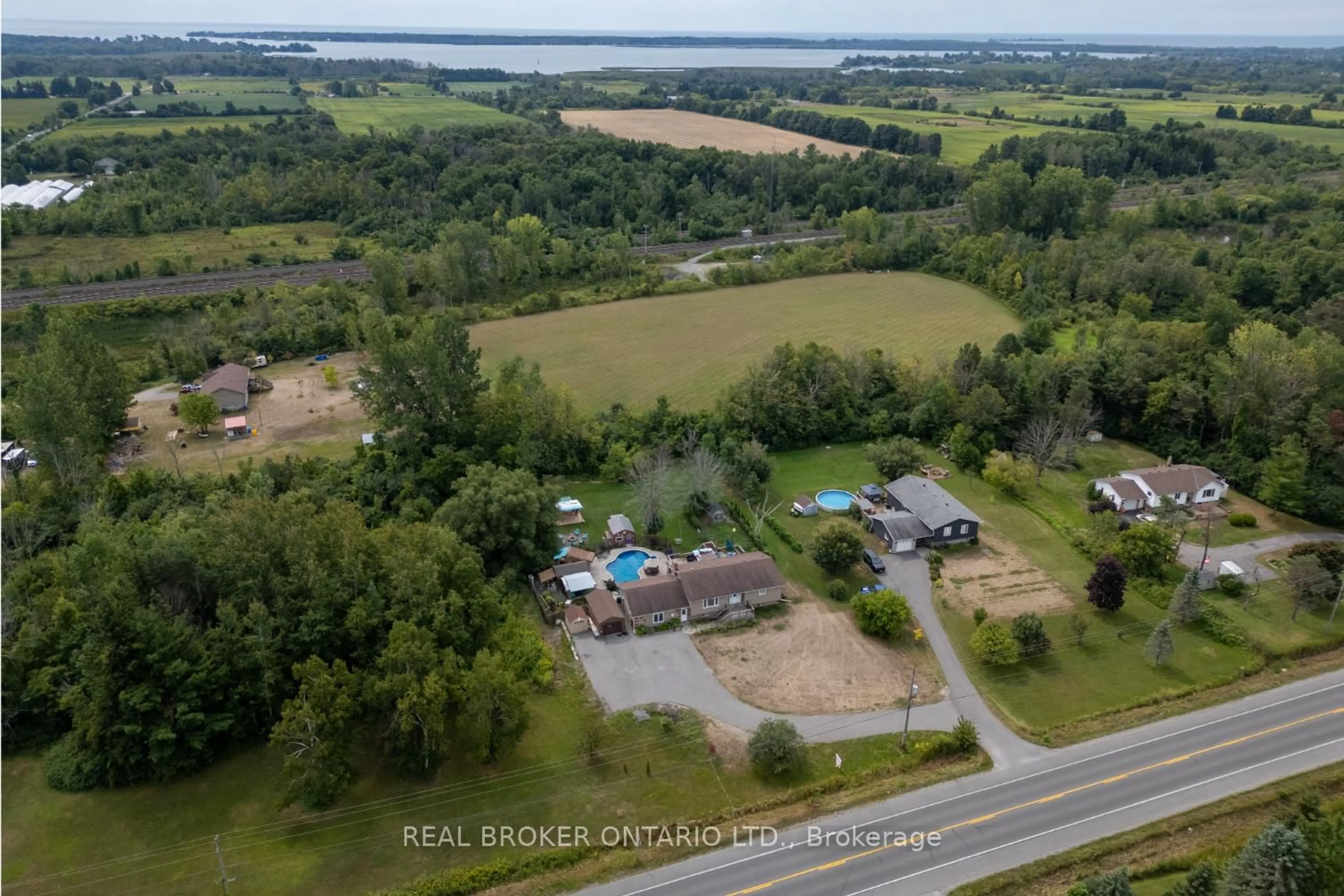 A pic from outside/outdoor area/front of a property/back of a property/a pic from drone, water/lake/river/ocean view for 15471 County Road 2, Brighton Ontario K0K 1H0