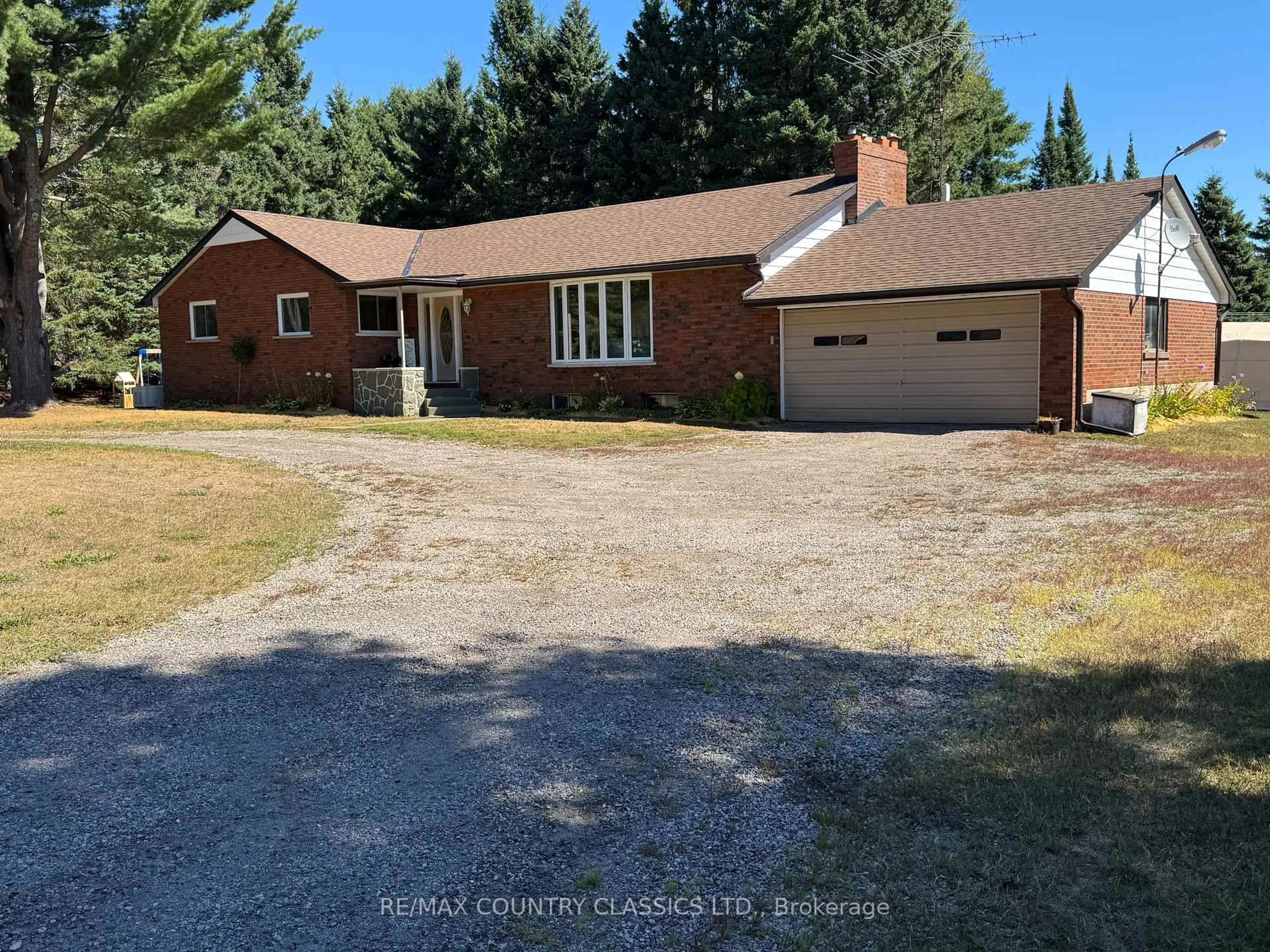 A pic from outside/outdoor area/front of a property/back of a property/a pic from drone, street for 1012 Clement Lake Rd, Highlands East Ontario K0L 3C0