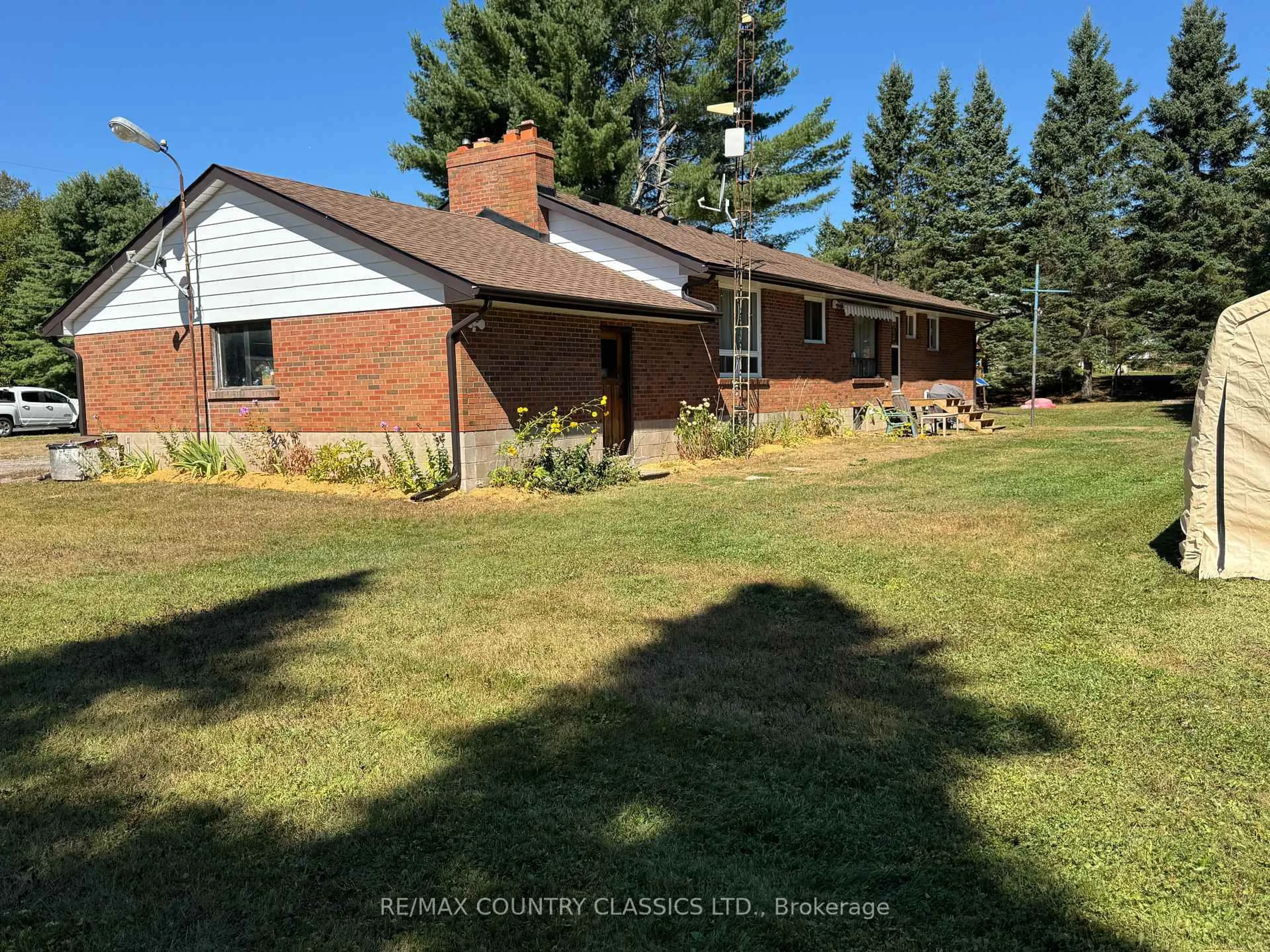 A pic from outside/outdoor area/front of a property/back of a property/a pic from drone, unknown for 1012 Clement Lake Rd, Highlands East Ontario K0L 3C0