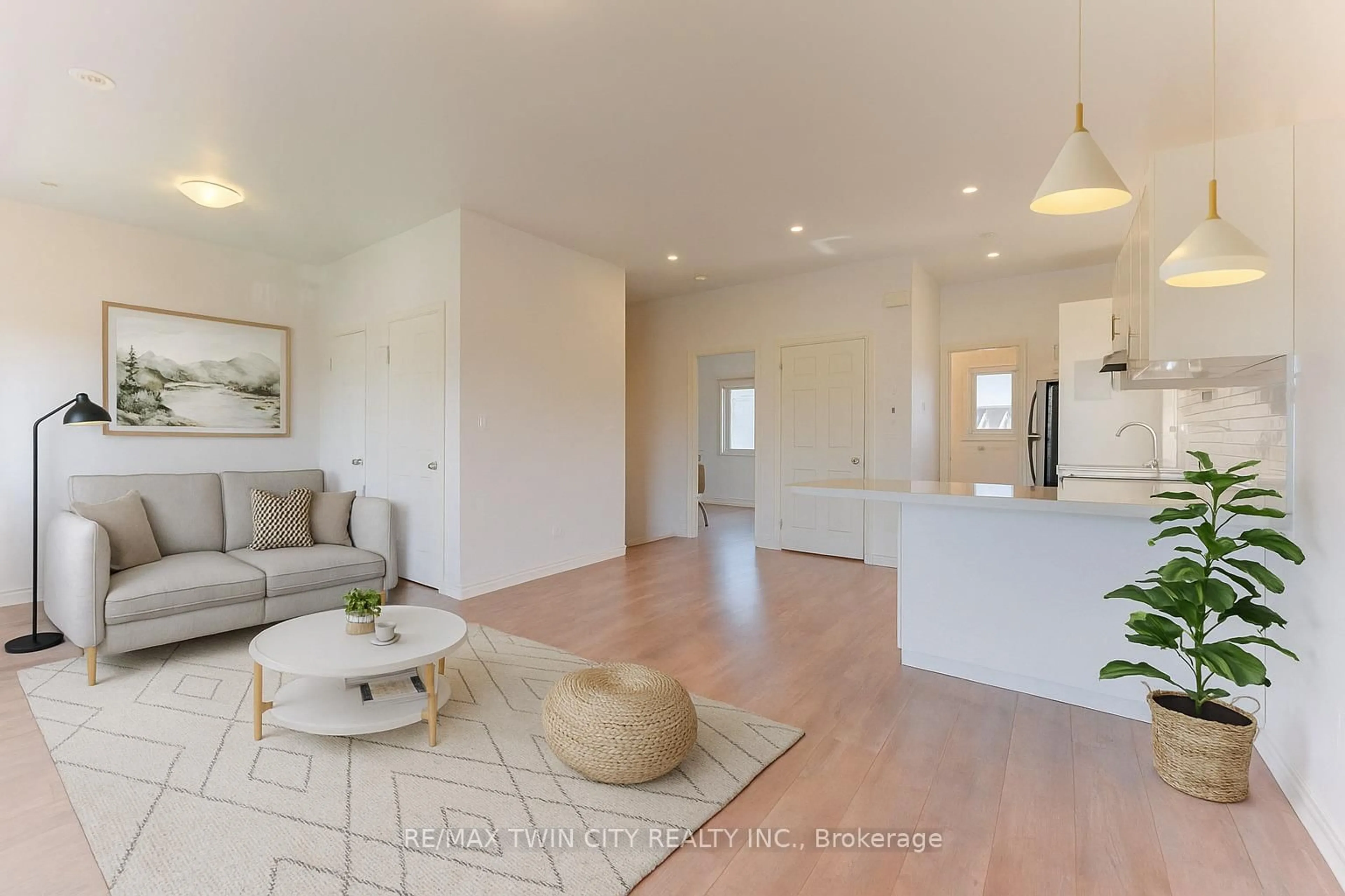 Living room with furniture, wood/laminate floor for 164 Heiman St #9C, Kitchener Ontario N2M 0B8