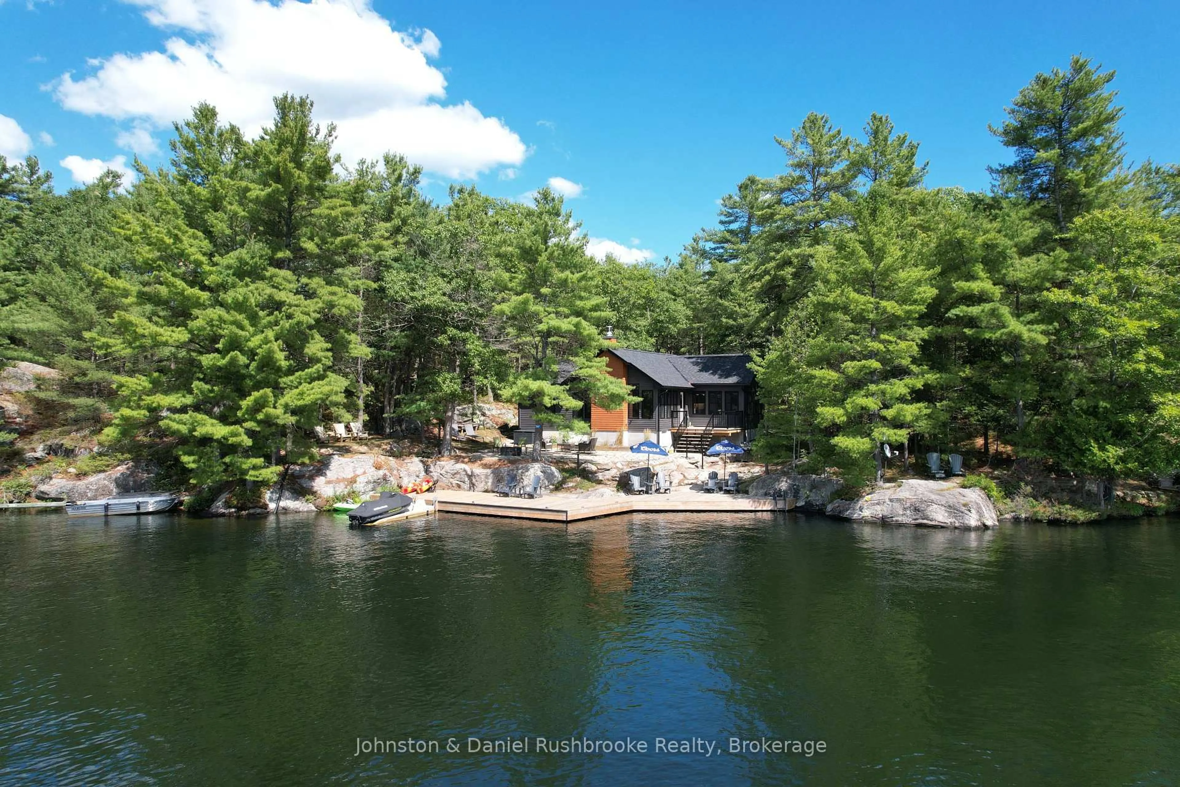 A pic from outside/outdoor area/front of a property/back of a property/a pic from drone, water/lake/river/ocean view for 5857 Severn River Shore, Georgian Bay Ontario L0K 1E0