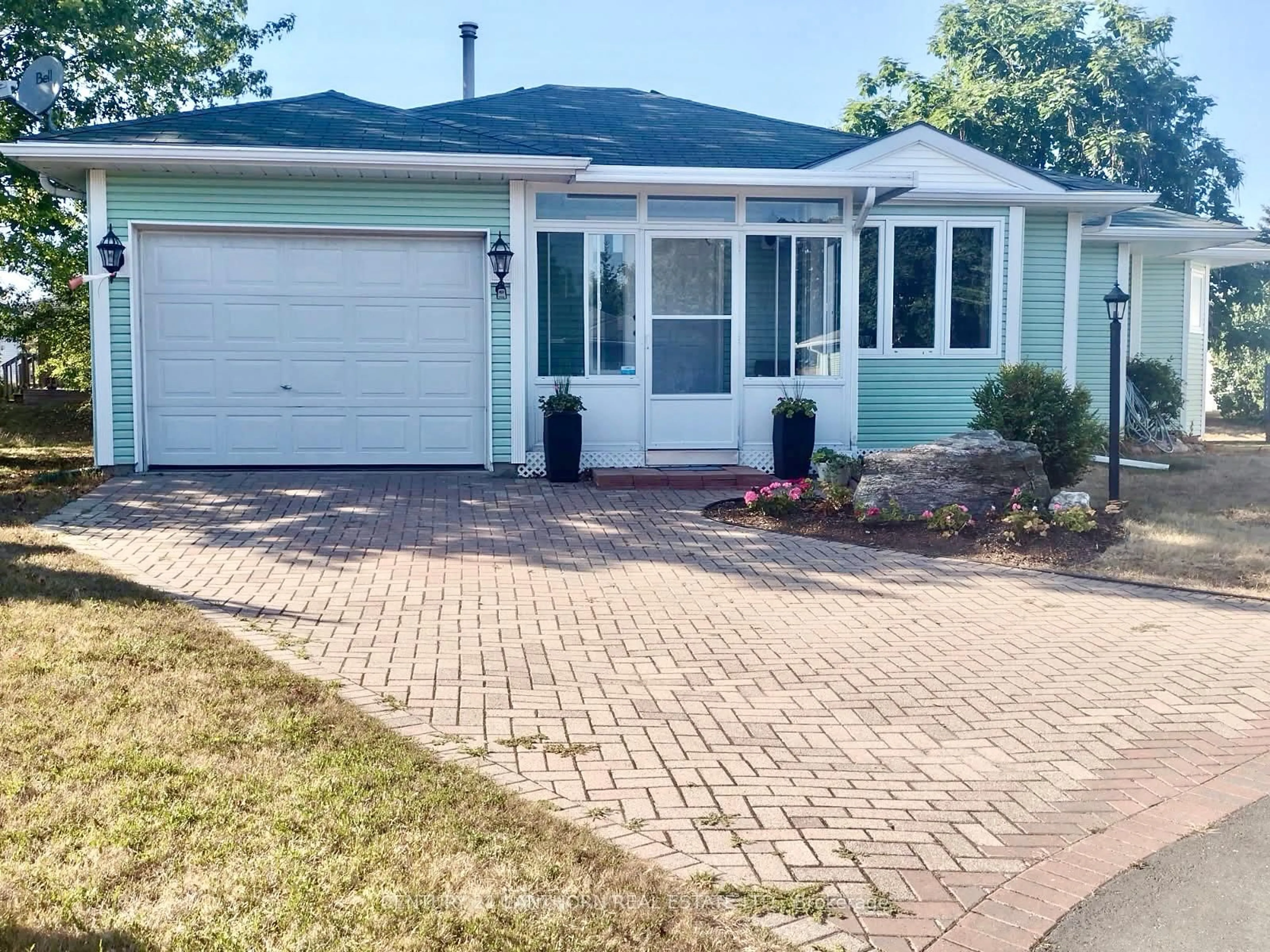 Home with vinyl exterior material, street for 9 Reynolds Pl, Prince Edward County Ontario K0K 3L0
