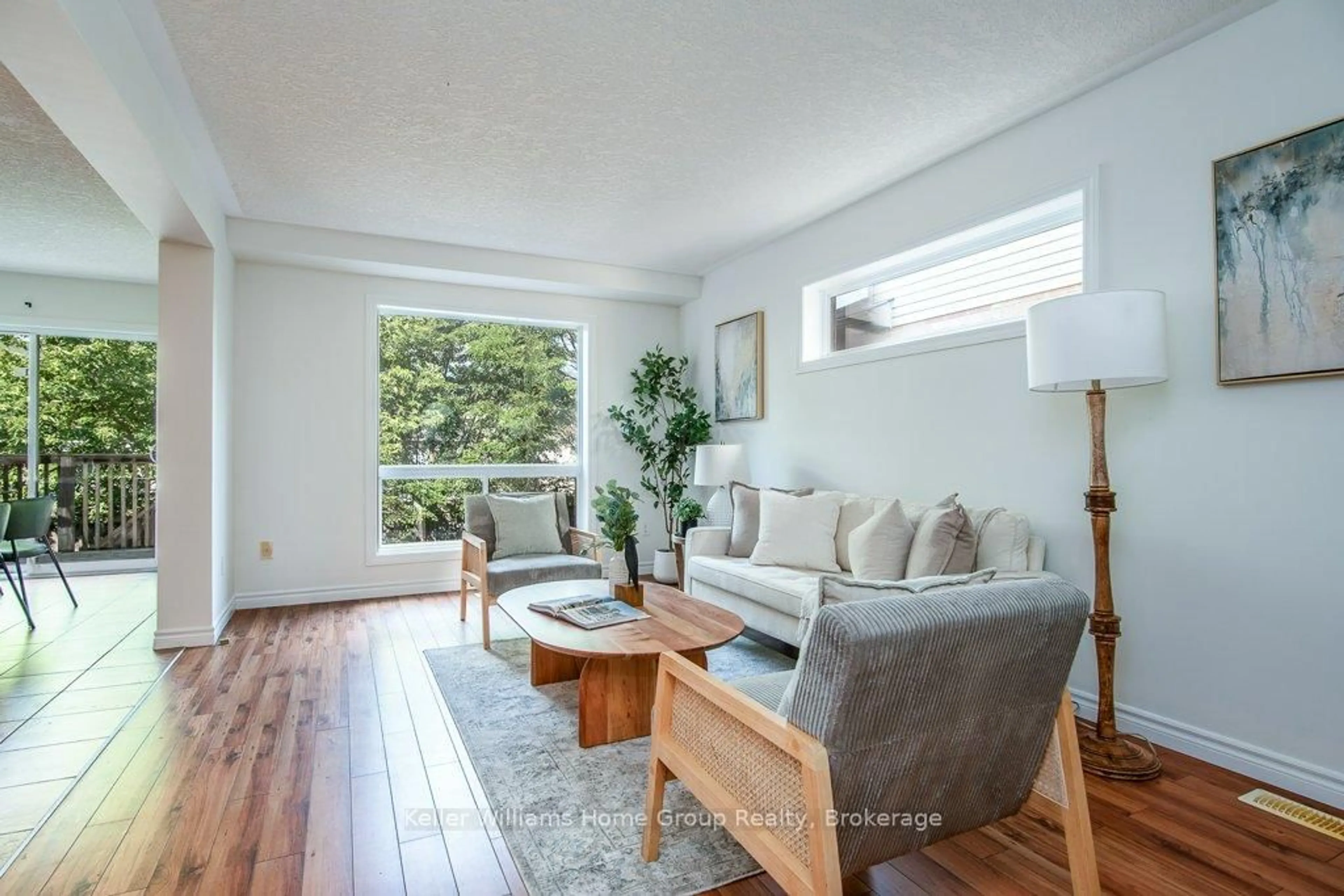 Living room with furniture, wood/laminate floor for 230 Rickson Ave, Guelph Ontario N1G 5H1