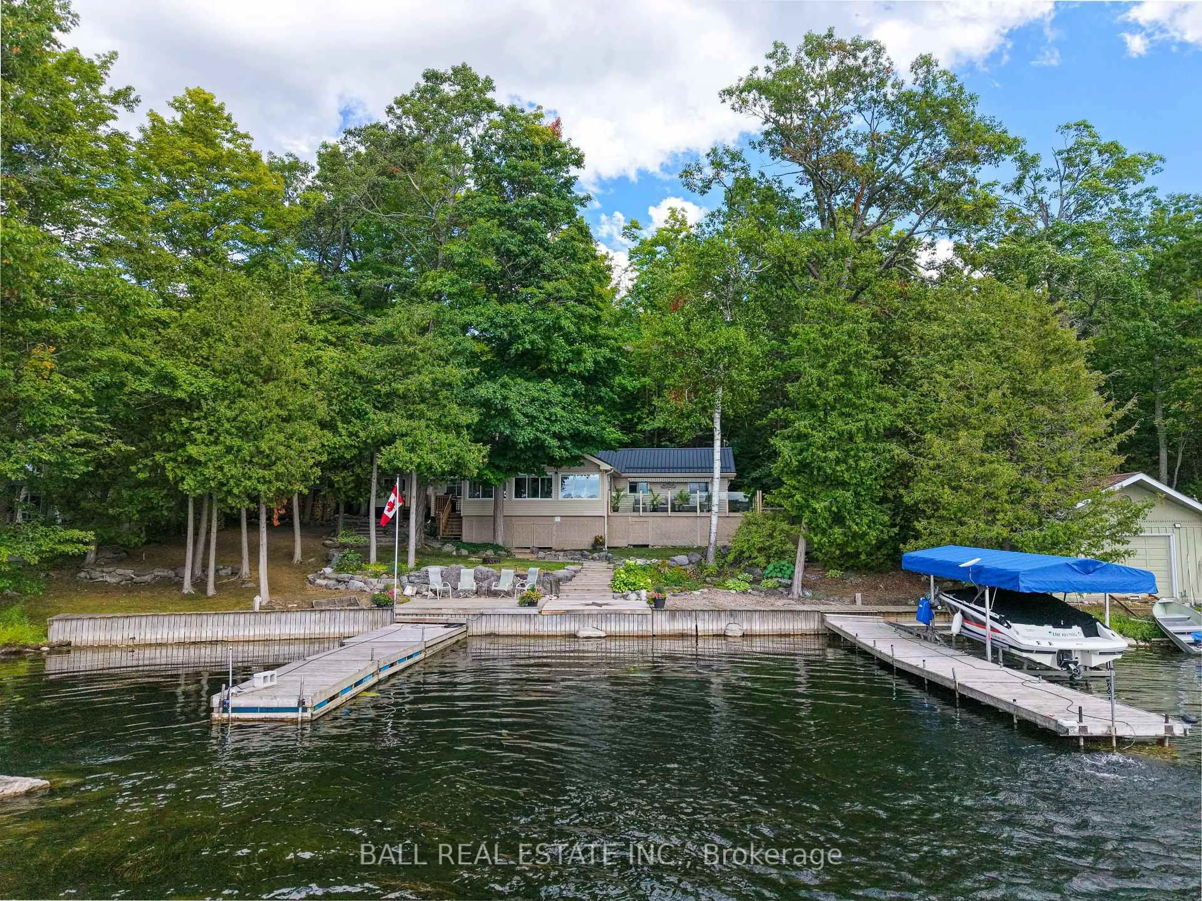 A pic from outside/outdoor area/front of a property/back of a property/a pic from drone, water/lake/river/ocean view for 27 Maplewood Crt, Trent Lakes Ontario K0L 1J0