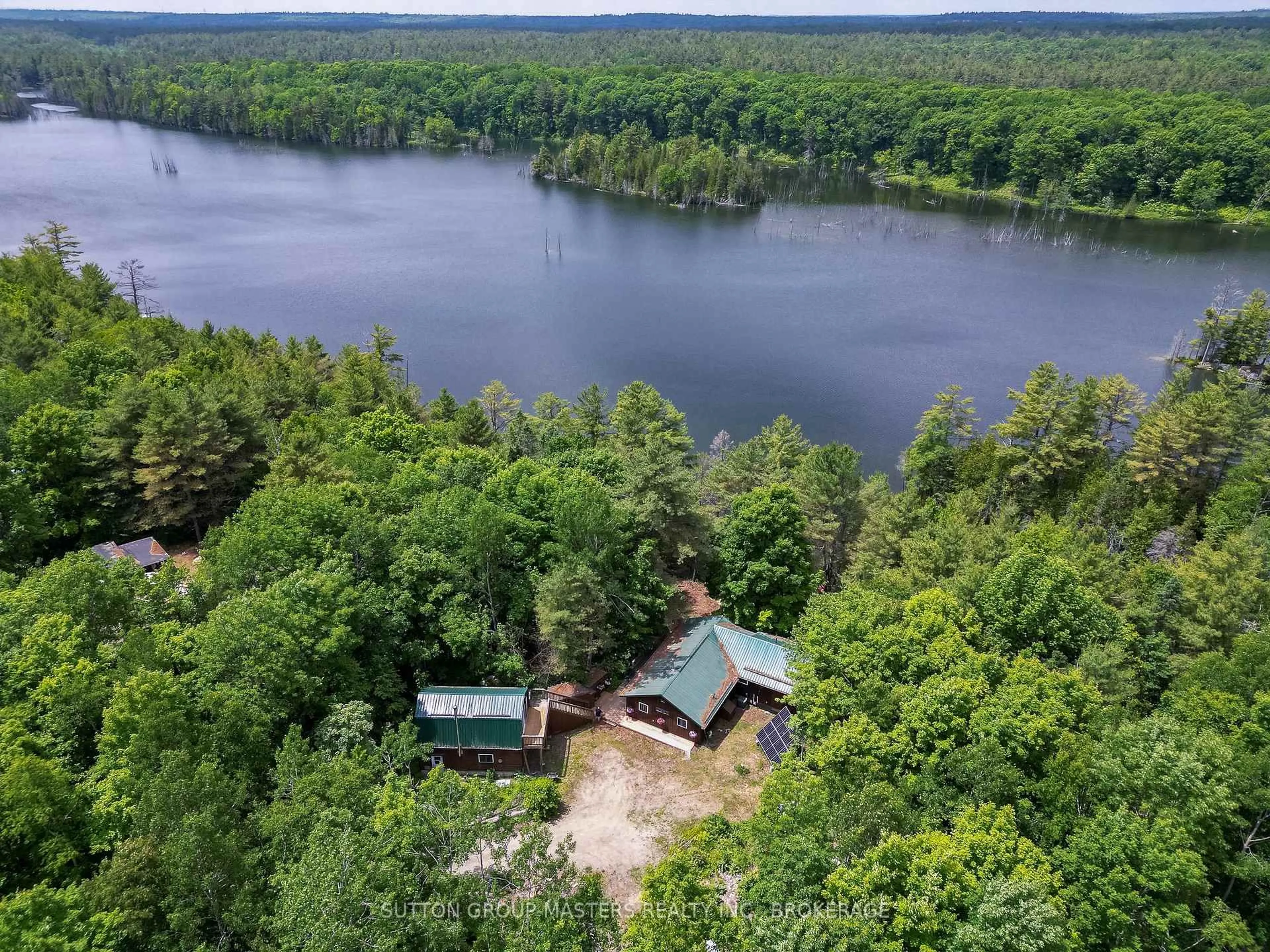 A pic from outside/outdoor area/front of a property/back of a property/a pic from drone, water/lake/river/ocean view for 313 Raccoon Lake Trail Rd, Kaladar Ontario K0H 1Z0