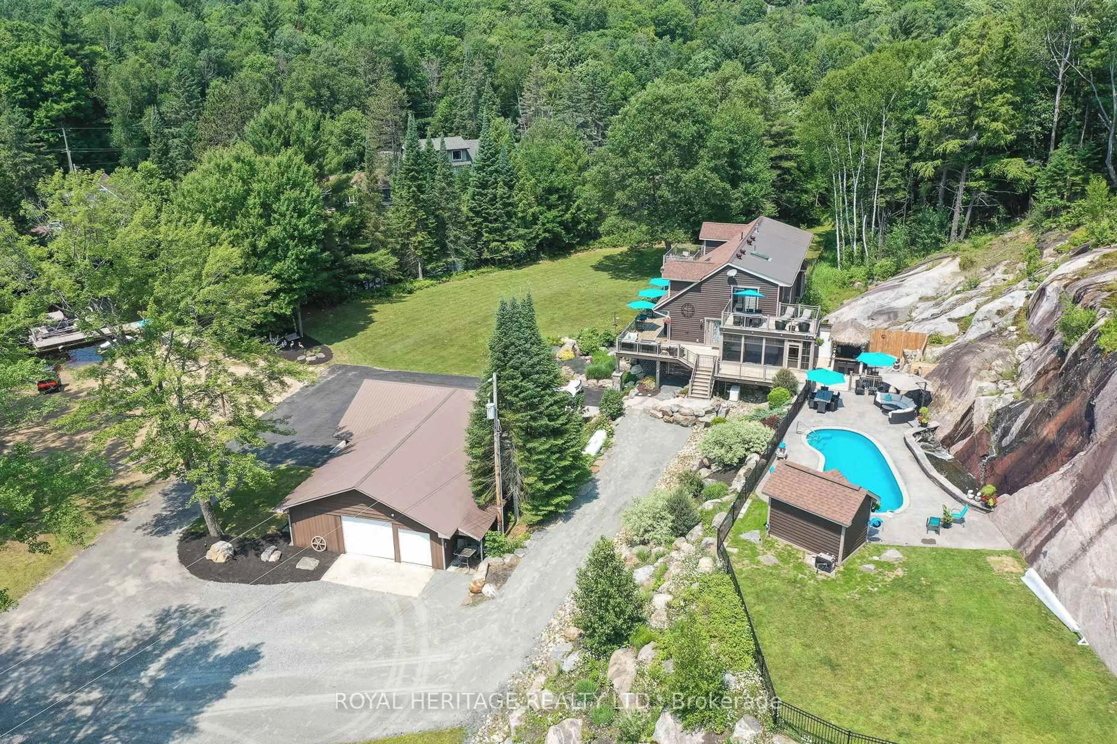 A pic from outside/outdoor area/front of a property/back of a property/a pic from drone, mountain view for 120 Hutcheson Beach Rd, Huntsville Ontario P1H 1N4