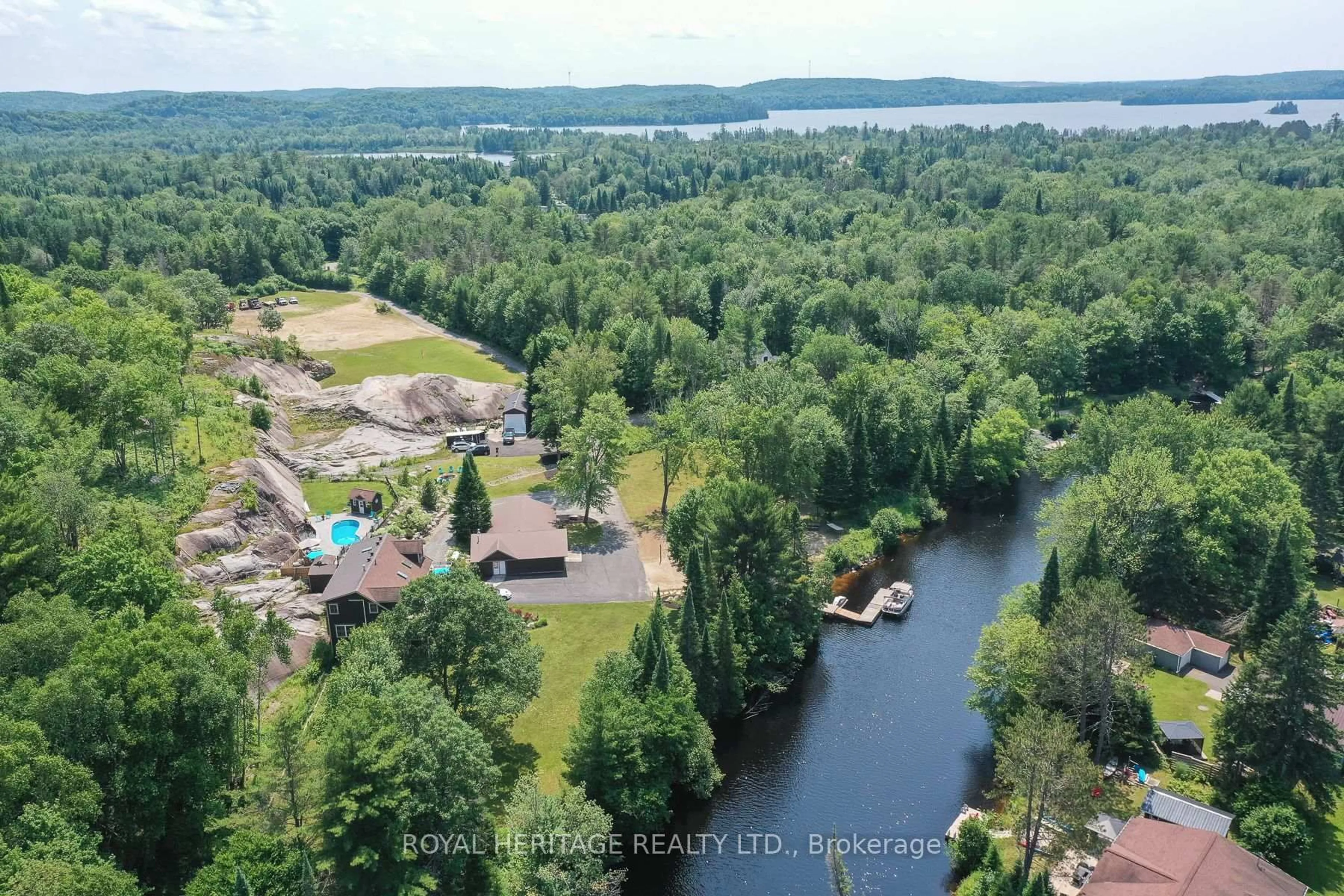 A pic from outside/outdoor area/front of a property/back of a property/a pic from drone, water/lake/river/ocean view for 120 Hutcheson Beach Rd, Huntsville Ontario P1H 1N4