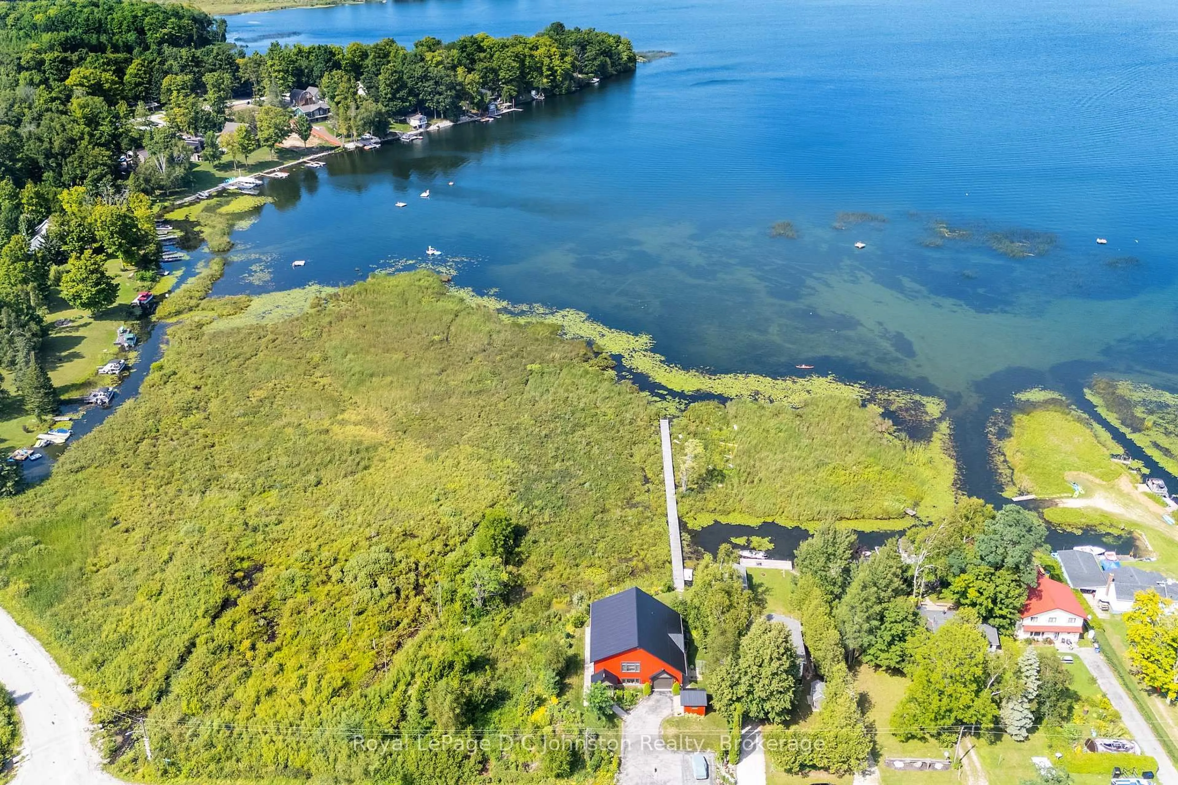 A pic from outside/outdoor area/front of a property/back of a property/a pic from drone, water/lake/river/ocean view for 11 Lake Dr, South Bruce Peninsula Ontario N0H 1A0