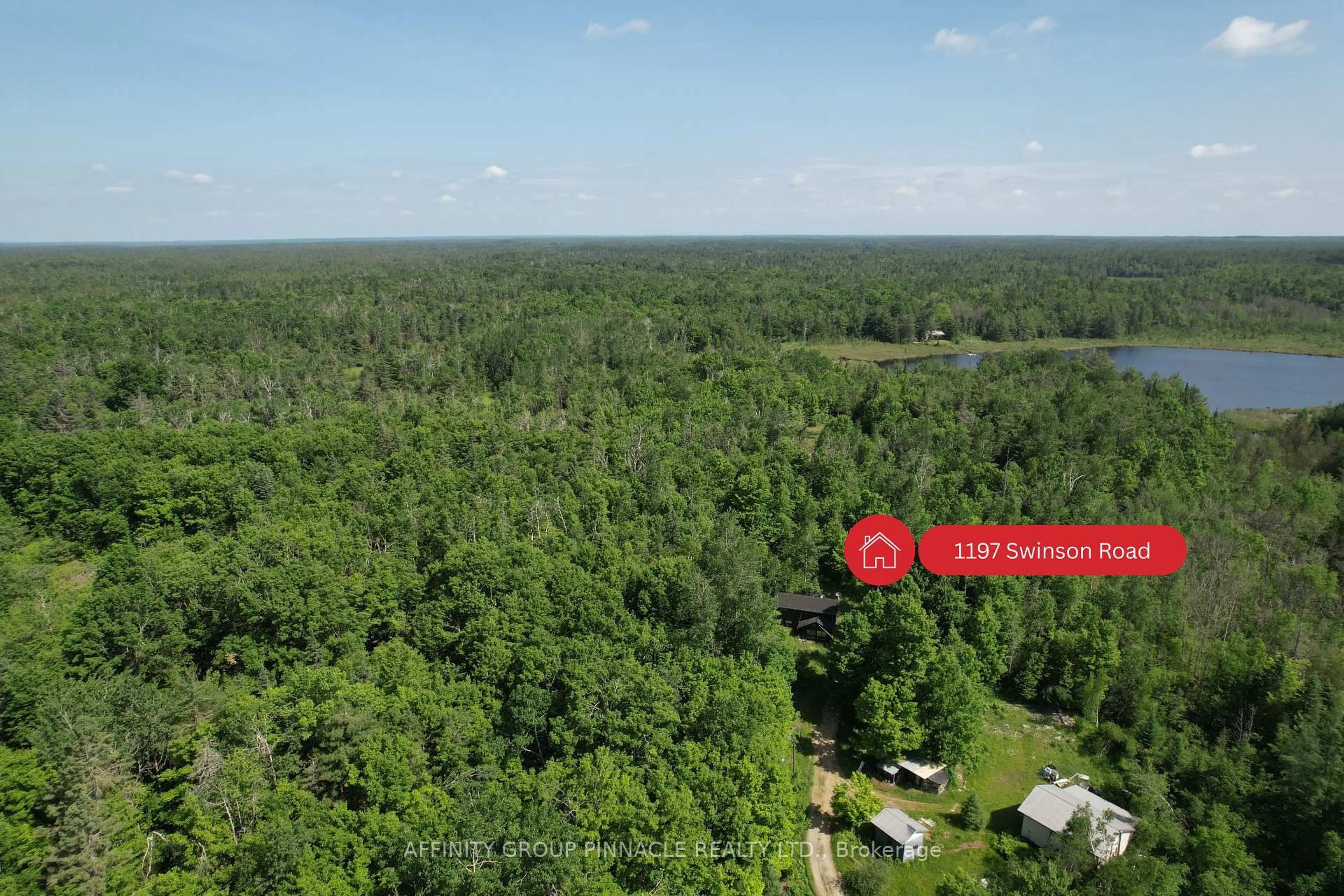A pic from outside/outdoor area/front of a property/back of a property/a pic from drone, forest/trees view for 1197 Swinson Rd, Minden Hills Ontario K0M 2A1