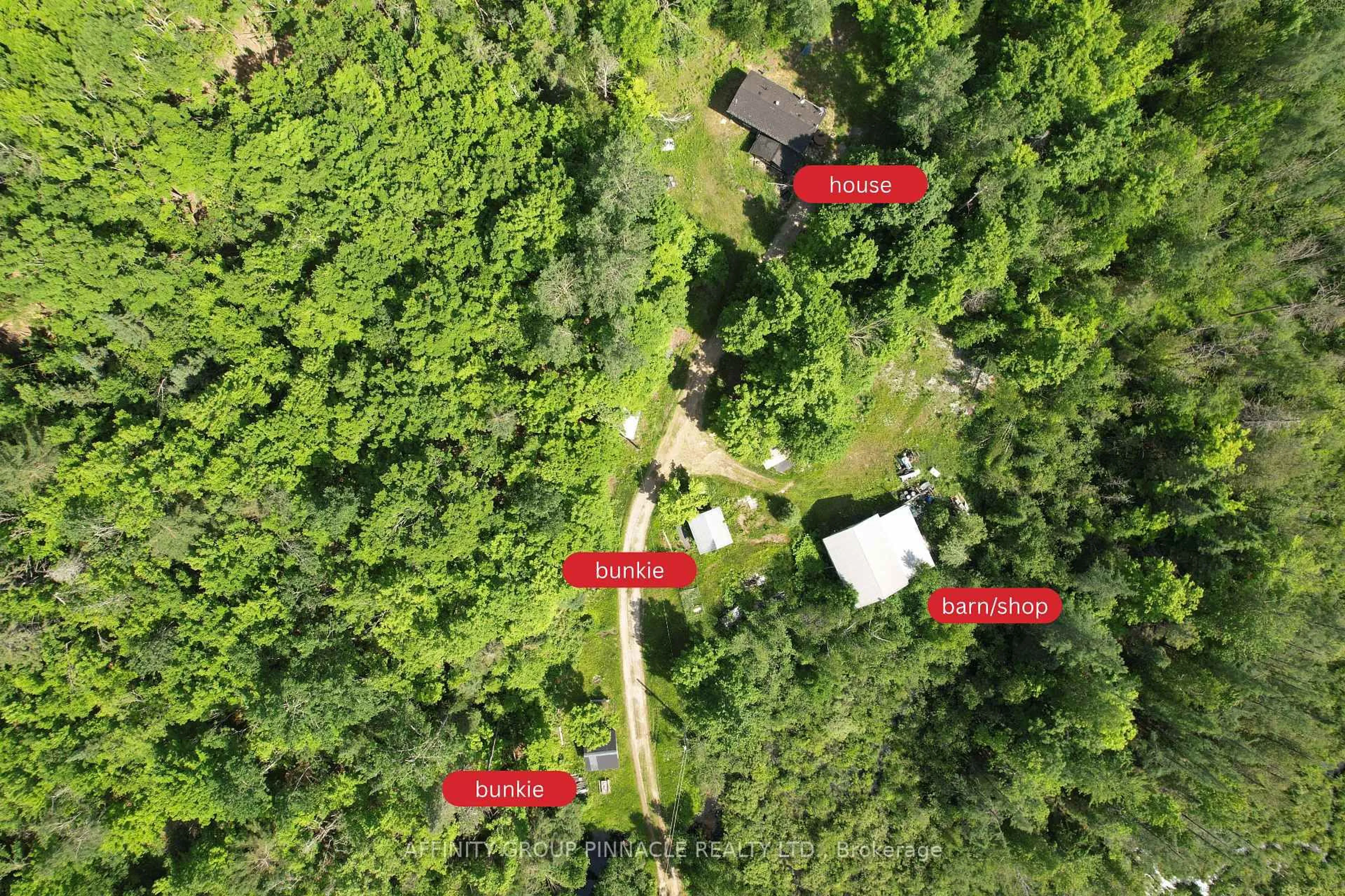 A pic from outside/outdoor area/front of a property/back of a property/a pic from drone, forest/trees view for 1197 Swinson Rd, Minden Hills Ontario K0M 2A1