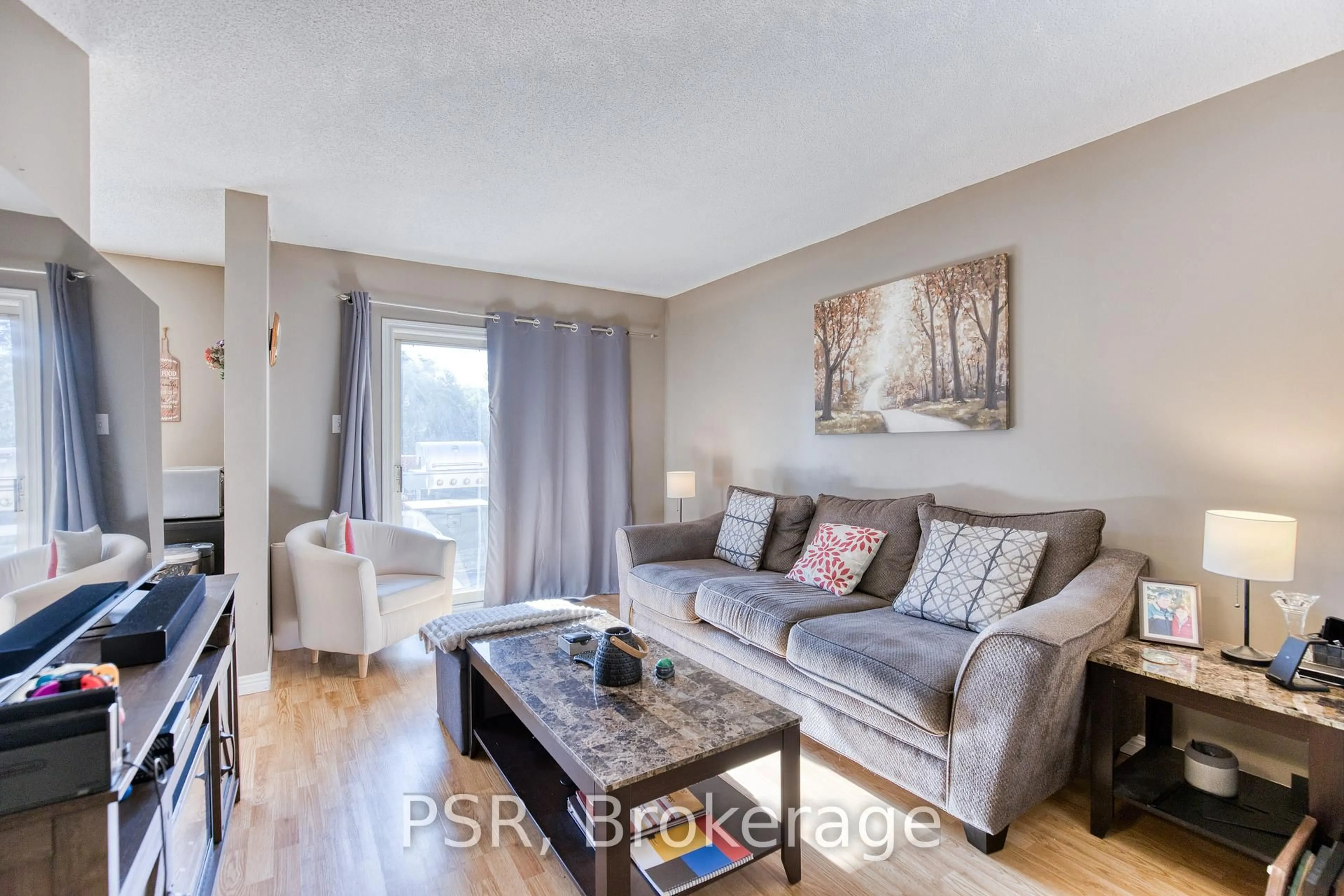 Living room with furniture, wood/laminate floor for 81 Brembel St, Kitchener Ontario N2B 3T7