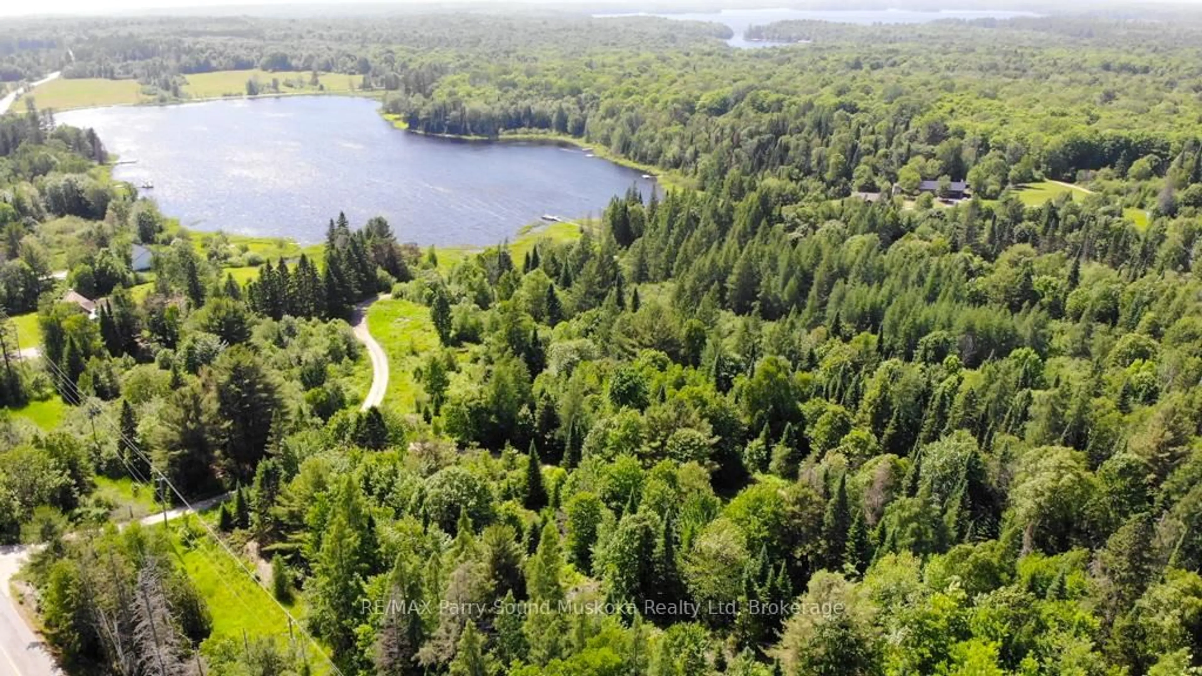 A pic from outside/outdoor area/front of a property/back of a property/a pic from drone, forest/trees view for 17 Ainslie Lake Rd, Whitestone Ontario P0A 1G0