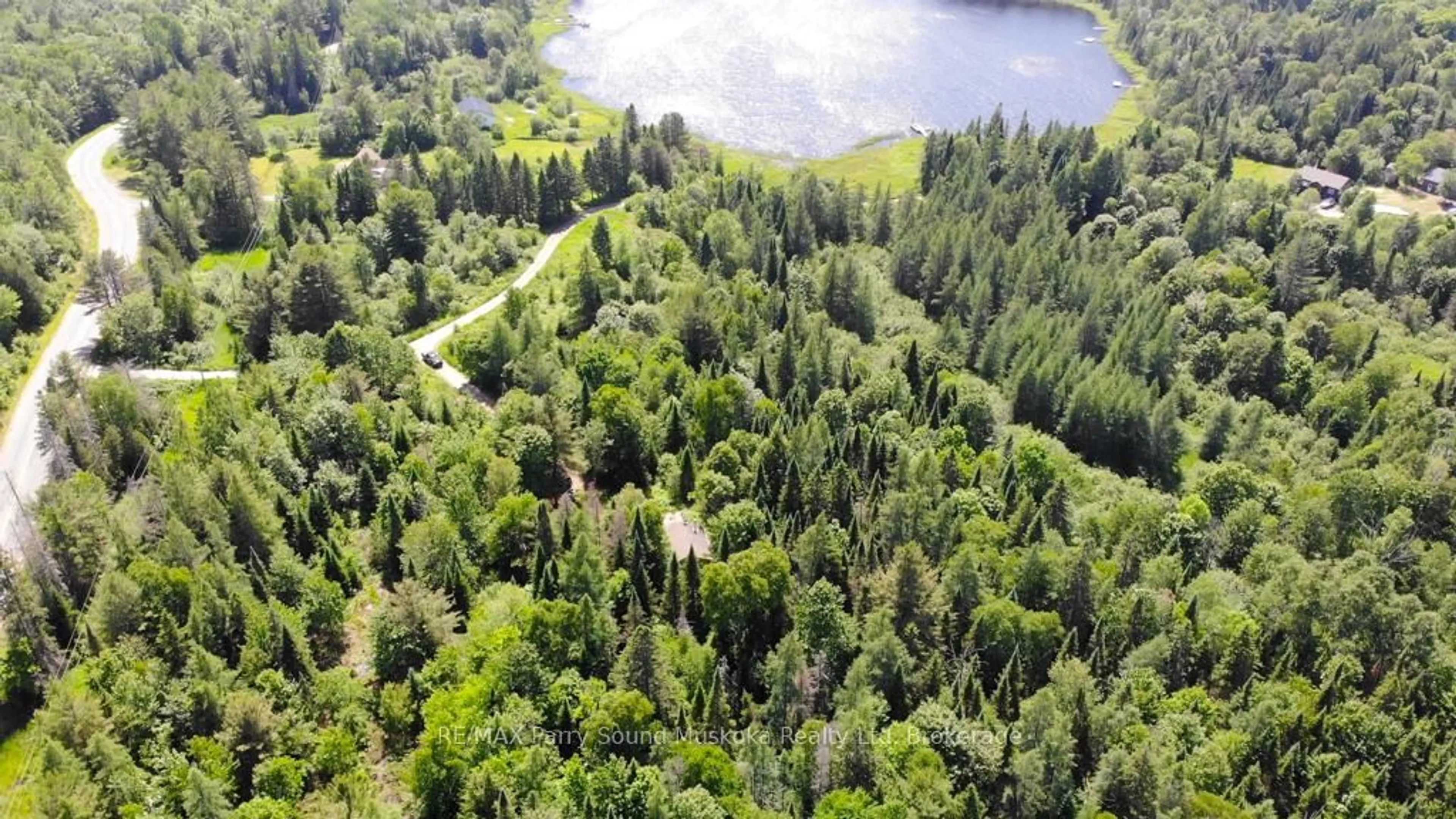 A pic from outside/outdoor area/front of a property/back of a property/a pic from drone, forest/trees view for 17 Ainslie Lake Rd, Whitestone Ontario P0A 1G0