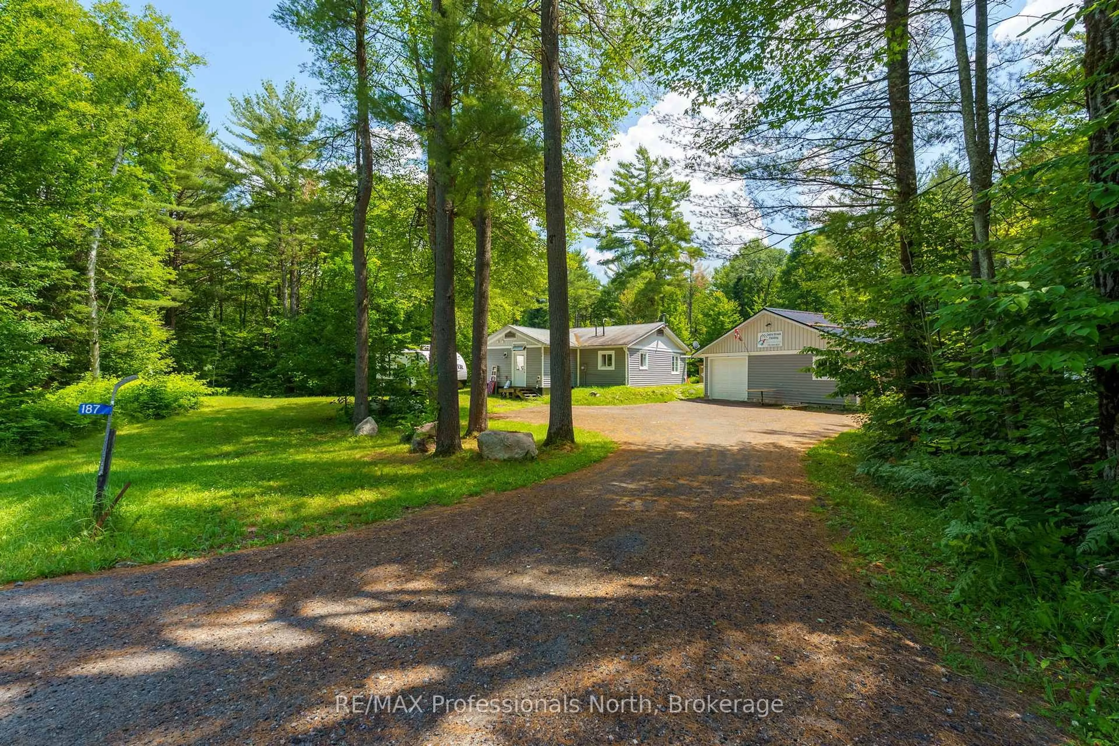 A pic from outside/outdoor area/front of a property/back of a property/a pic from drone, forest/trees view for 187 Stephenson 4 Rd, Huntsville Ontario P0B 1M0