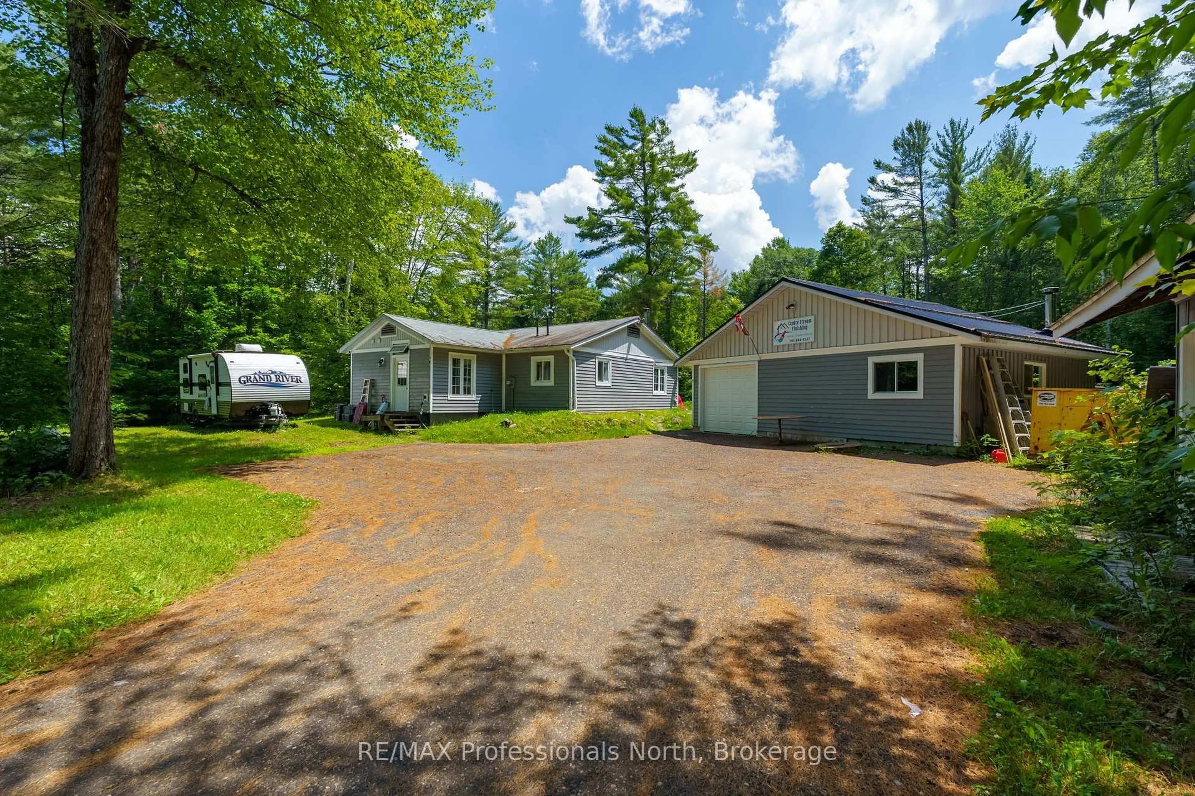 A pic from outside/outdoor area/front of a property/back of a property/a pic from drone, street for 187 Stephenson 4 Rd, Huntsville Ontario P0B 1M0