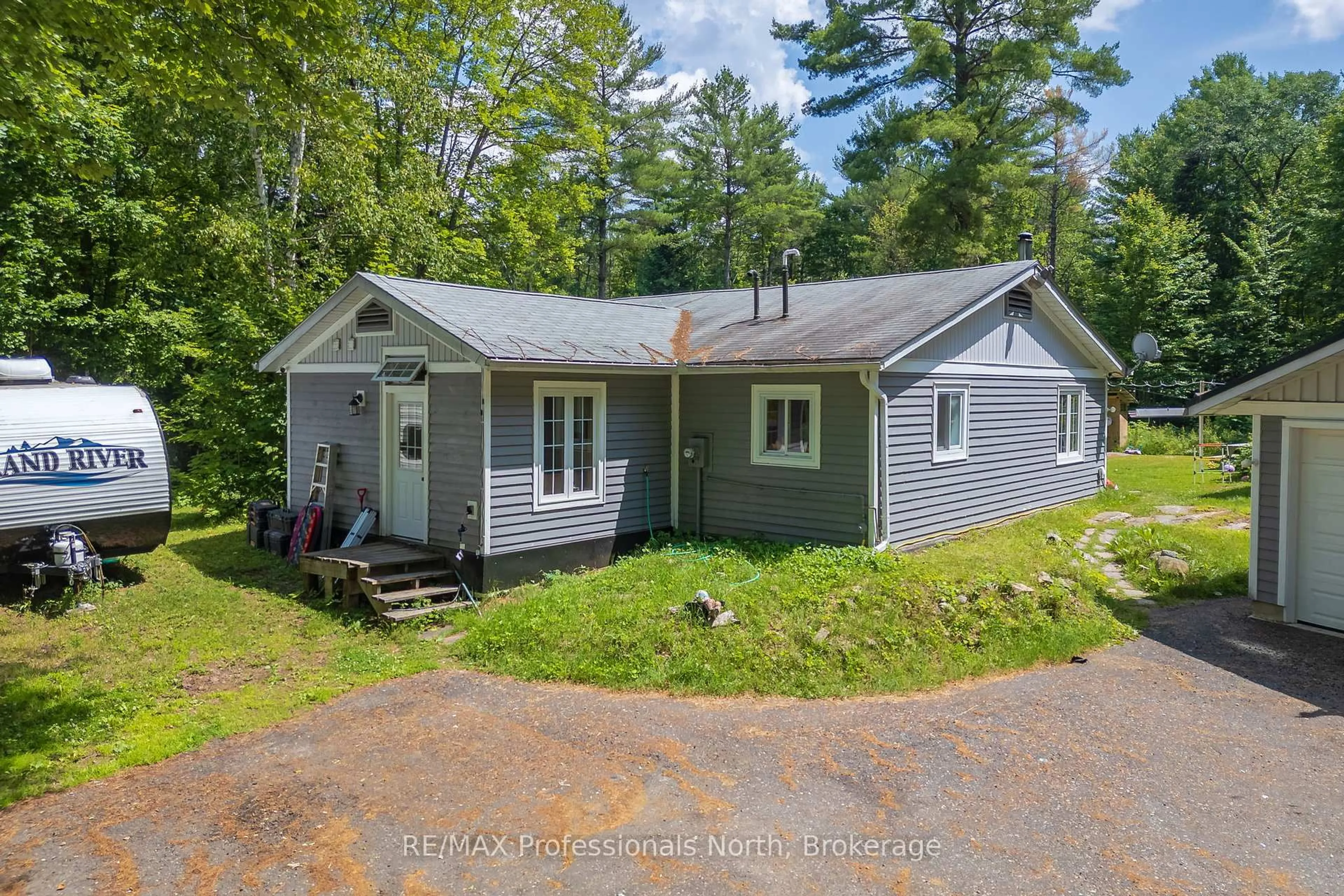 A pic from outside/outdoor area/front of a property/back of a property/a pic from drone, street for 187 Stephenson 4 Rd, Huntsville Ontario P0B 1M0