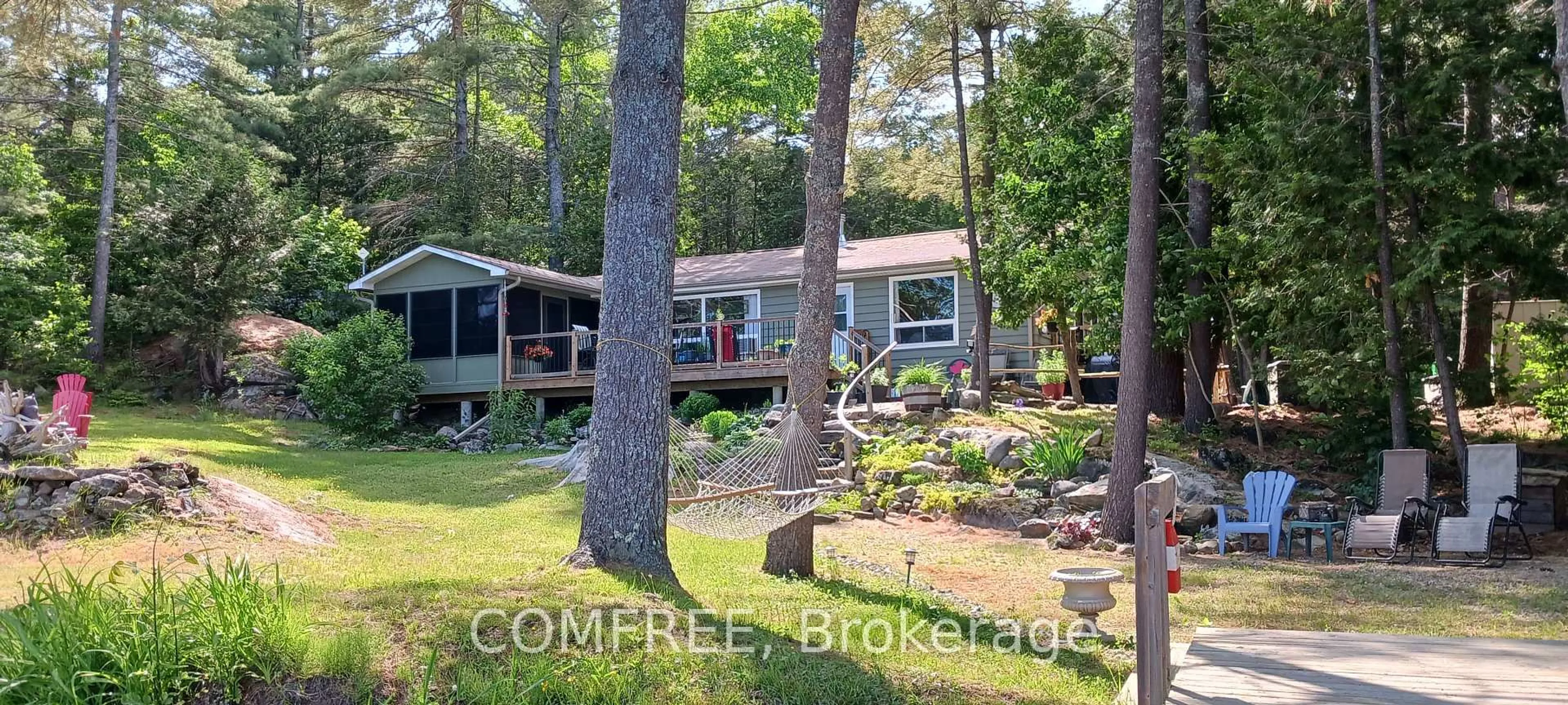 A pic from outside/outdoor area/front of a property/back of a property/a pic from drone, water/lake/river/ocean view for 1005 Hoyle Lane, Maberly Ontario K0H 2B0