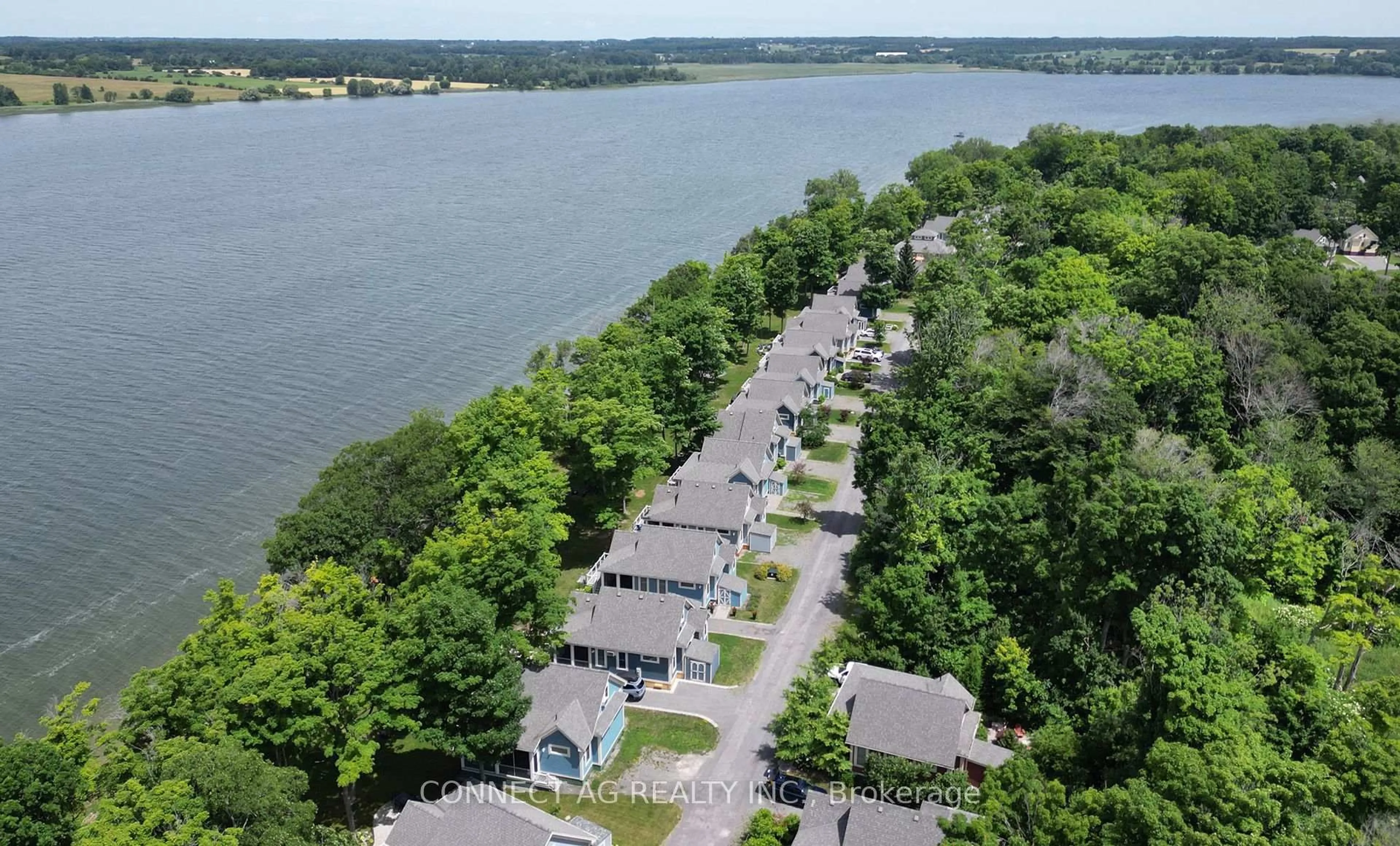 A pic from outside/outdoor area/front of a property/back of a property/a pic from drone, water/lake/river/ocean view for 44 Summer Village Lane #236, Prince Edward County Ontario K0K 1P0