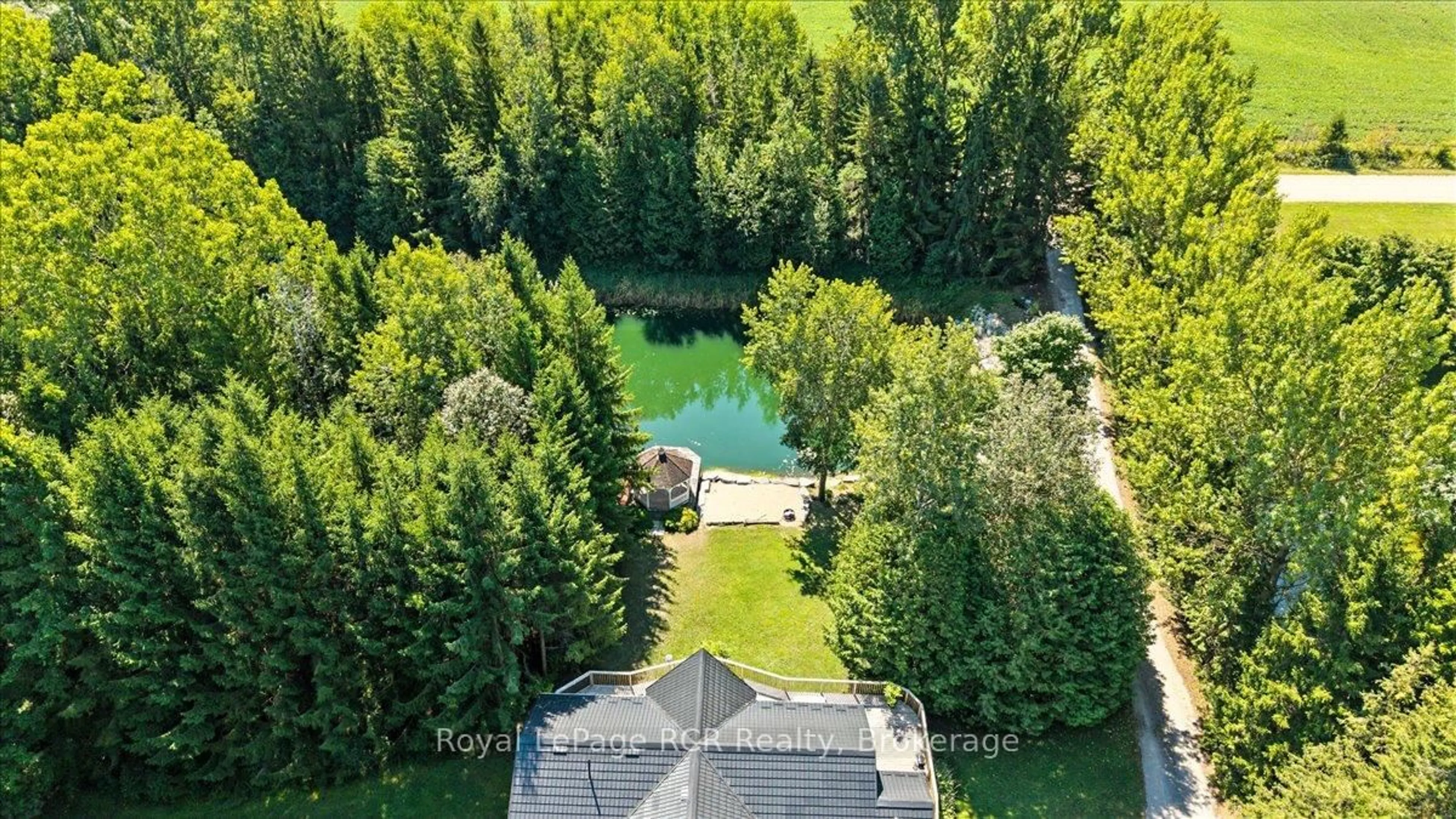 A pic from outside/outdoor area/front of a property/back of a property/a pic from drone, water/lake/river/ocean view for 102703 Road 49, West Grey Ontario N0G 2L0
