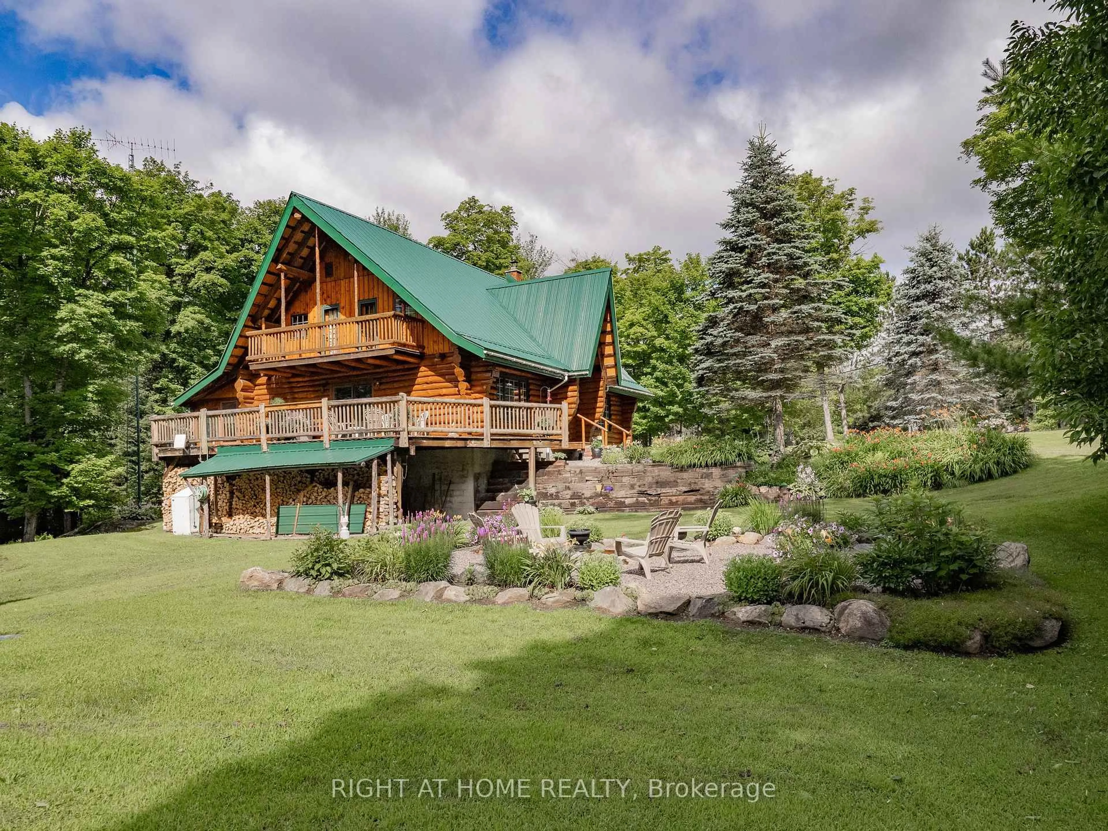 A pic from outside/outdoor area/front of a property/back of a property/a pic from drone, water/lake/river/ocean view for 1696 Highway 118, Bracebridge Ontario P1L 1X1