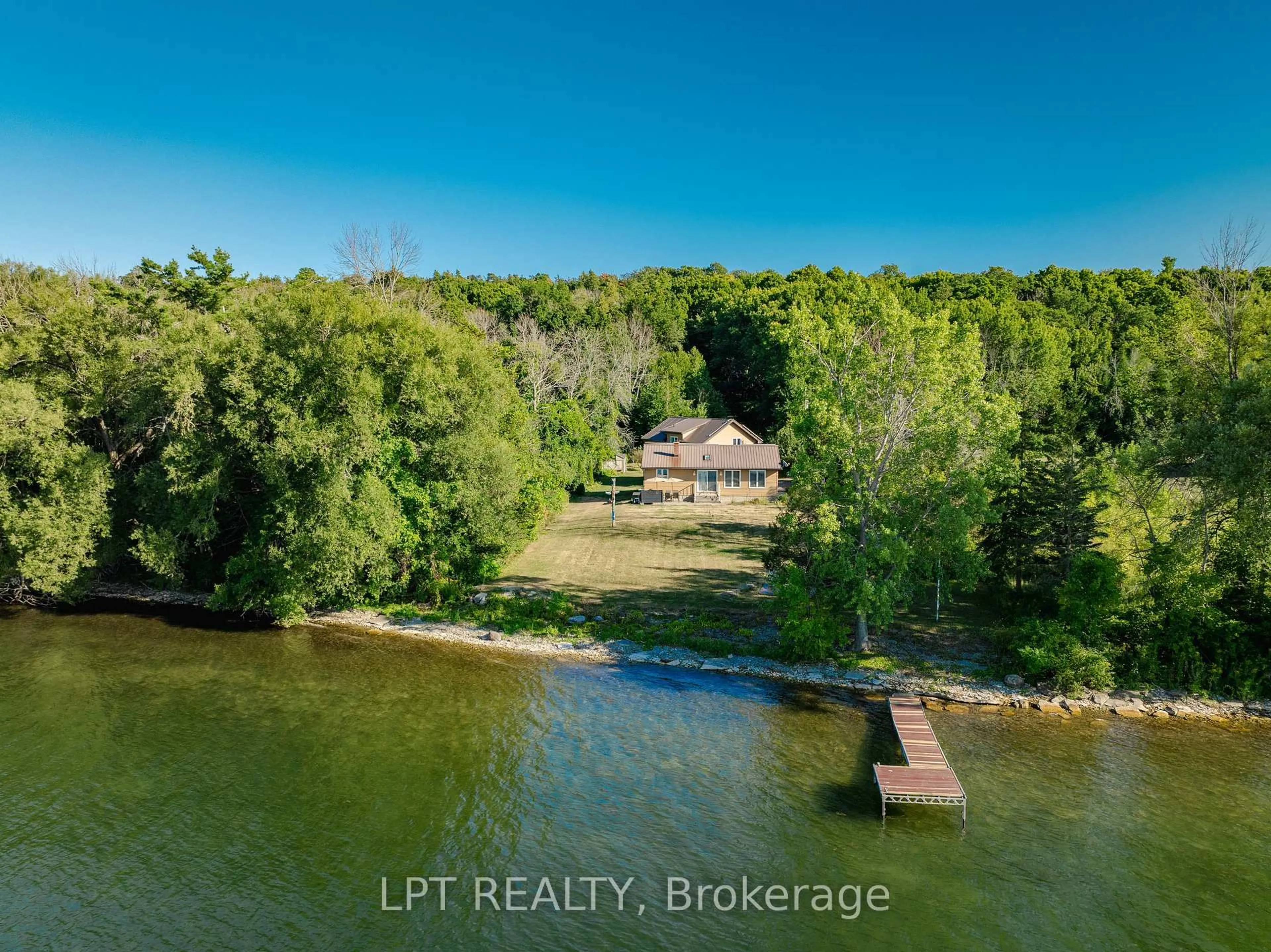 A pic from outside/outdoor area/front of a property/back of a property/a pic from drone, water/lake/river/ocean view for 1847 County Rd 7 Rd, Prince Edward County Ontario K0K 2T0