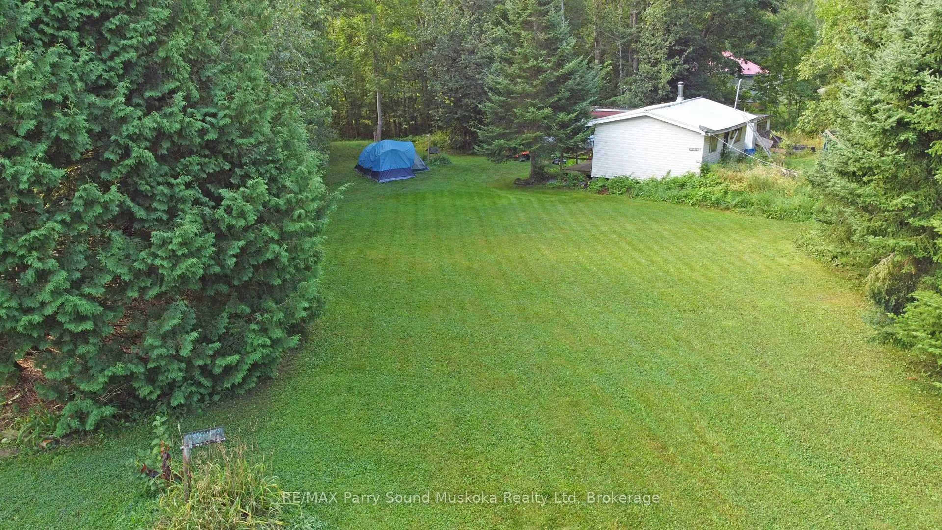 A pic from outside/outdoor area/front of a property/back of a property/a pic from drone, forest/trees view for 9 Fisher Lane, Whitestone Ontario P0A 1G0