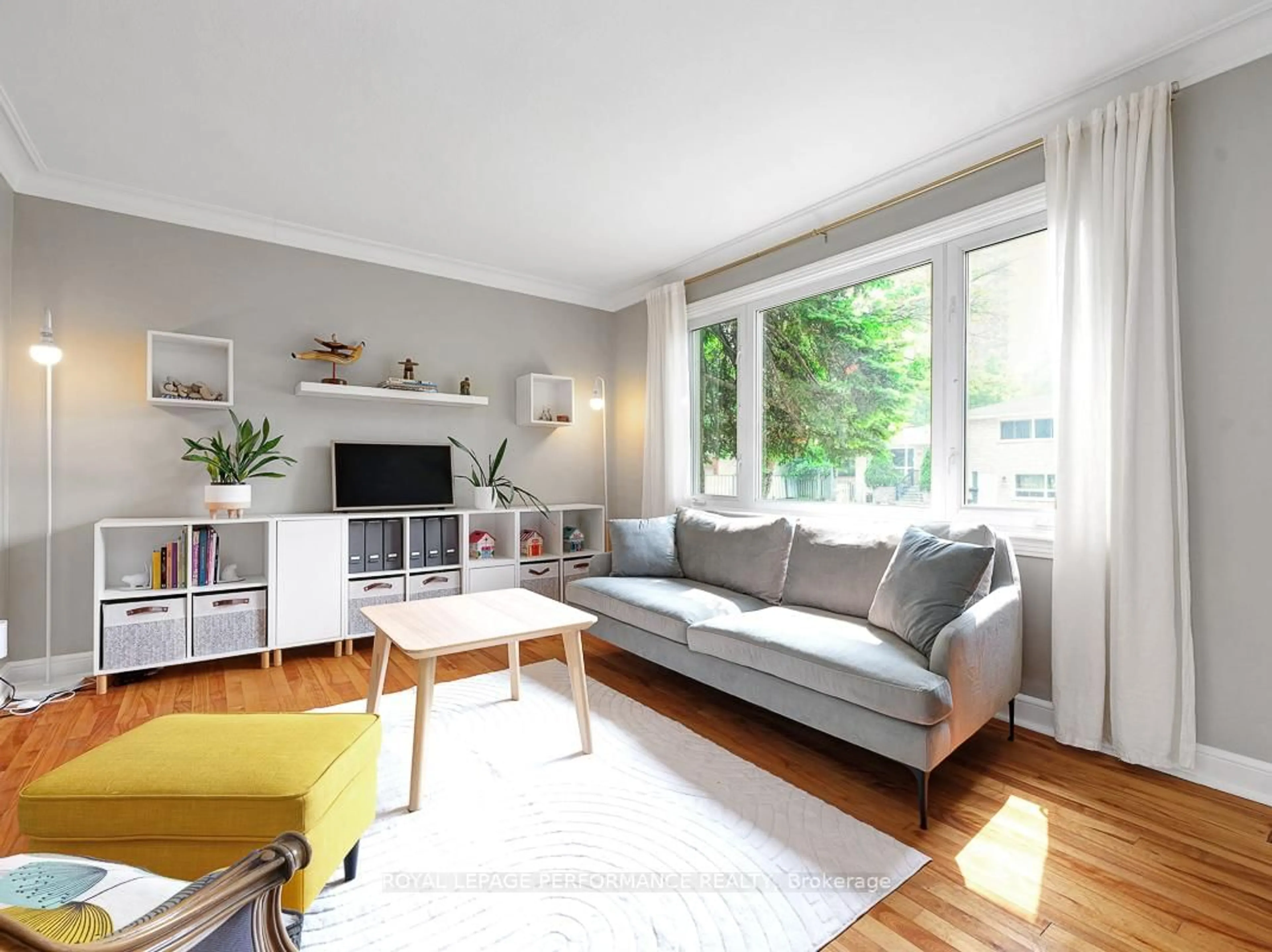 Living room with furniture, wood/laminate floor for 405 Allen Blvd, Ottawa Ontario K1L 7B6