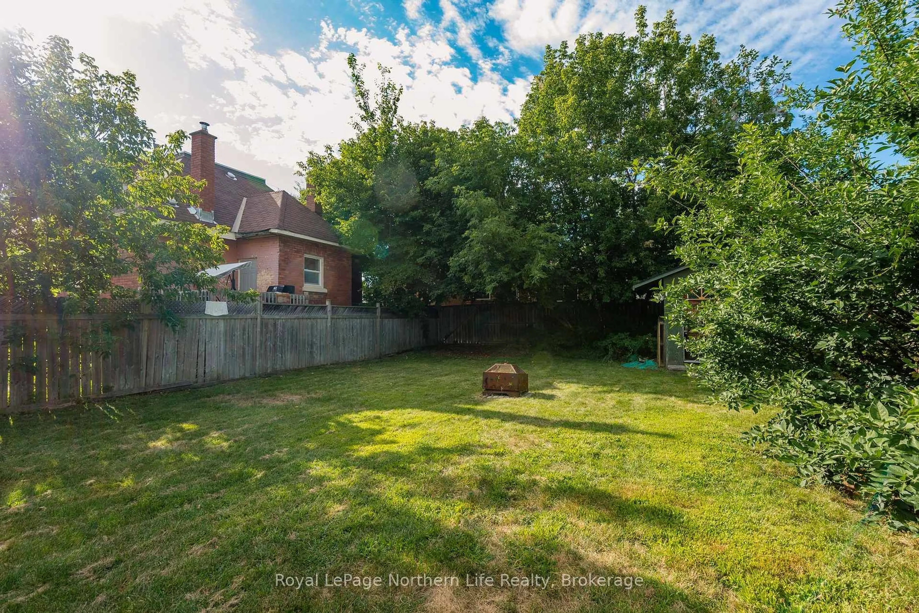 A pic from outside/outdoor area/front of a property/back of a property/a pic from drone, forest/trees view for 920 Fraser St, North Bay Ontario P1B 3X8