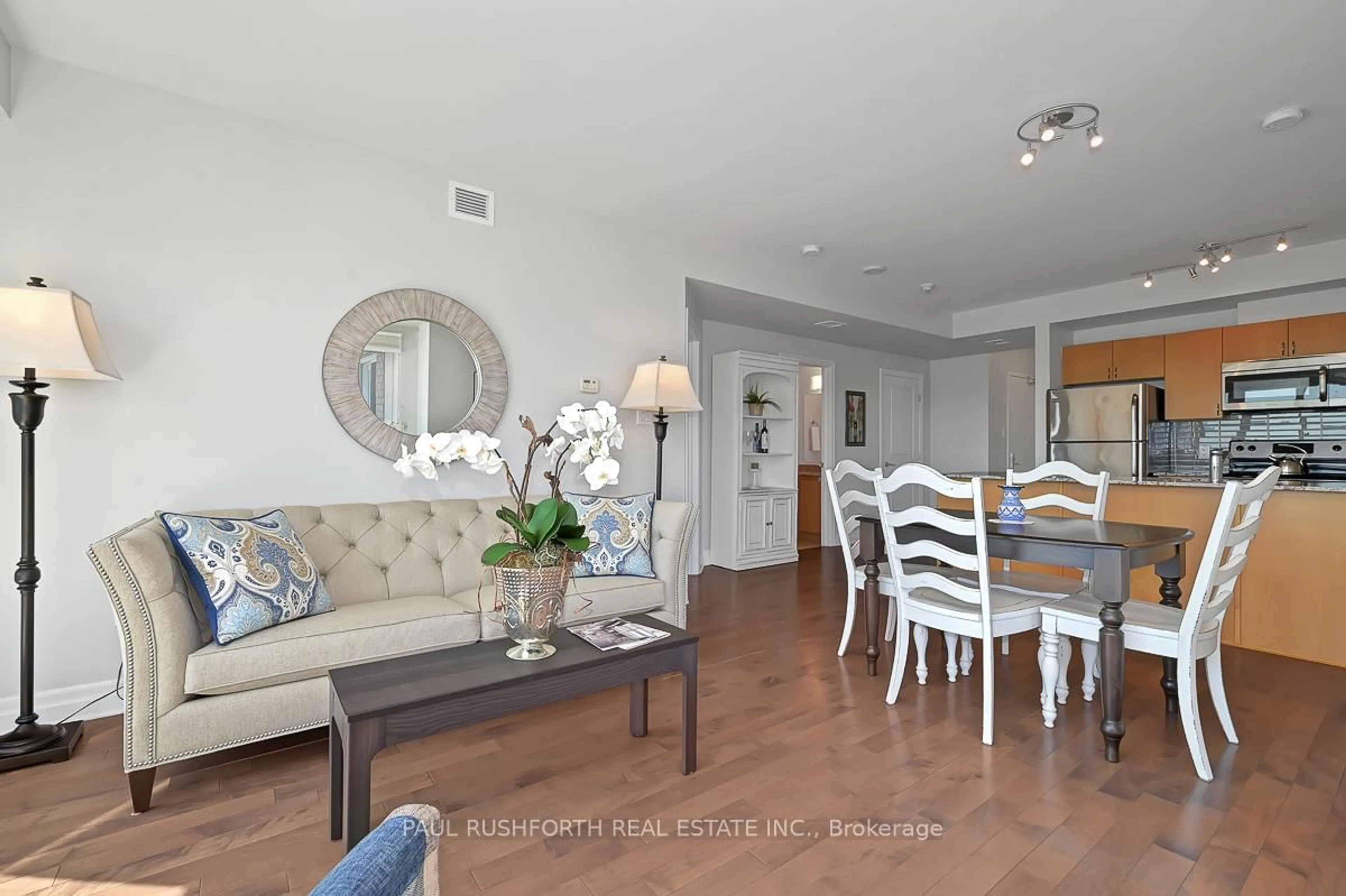 Living room with furniture, wood/laminate floor for 90 Landry St #1007, Ottawa Ontario K1L 0A9