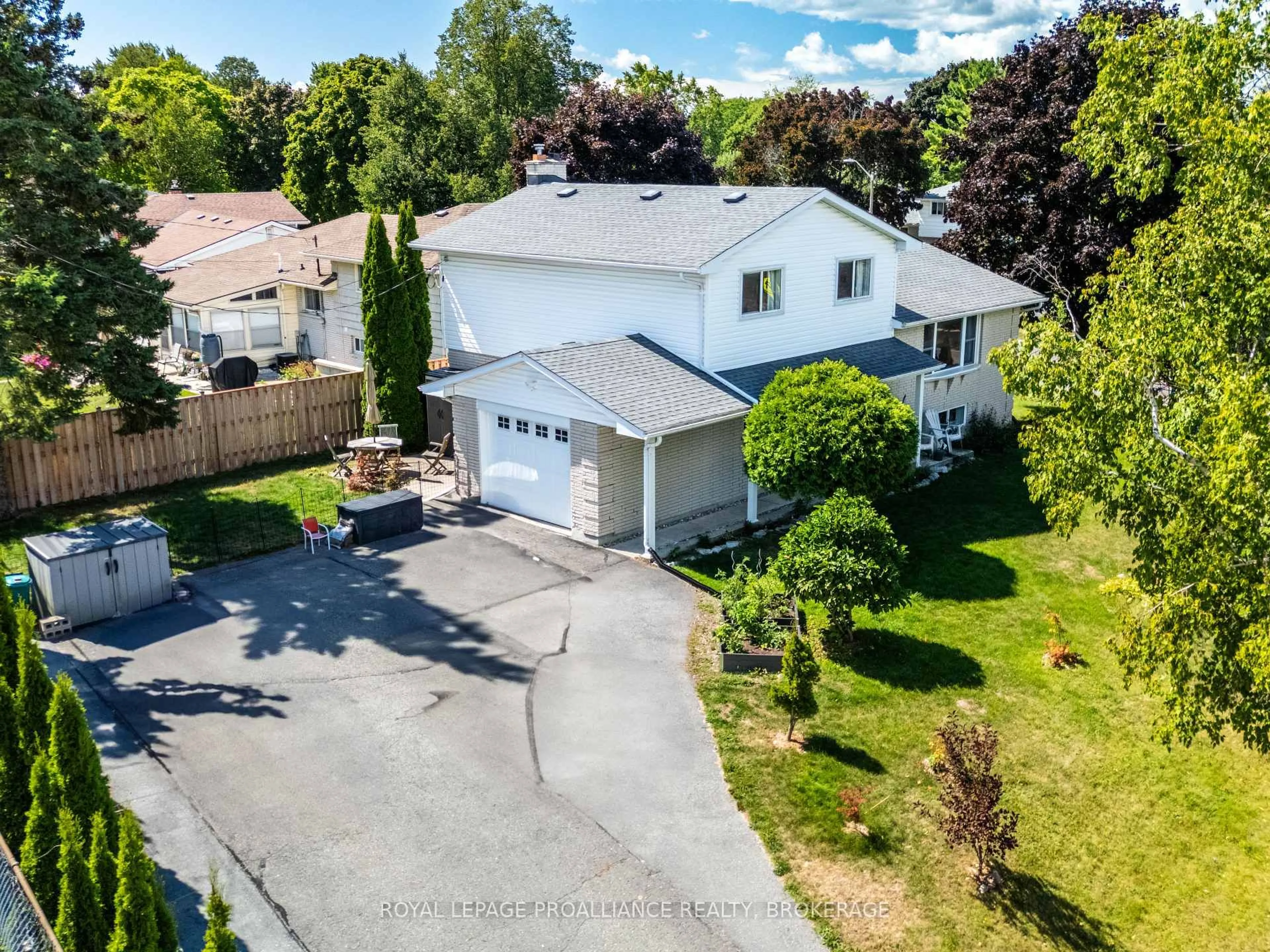 A pic from outside/outdoor area/front of a property/back of a property/a pic from drone, street for 228 Robert Wallace Dr, Kingston Ontario K7M 6C3