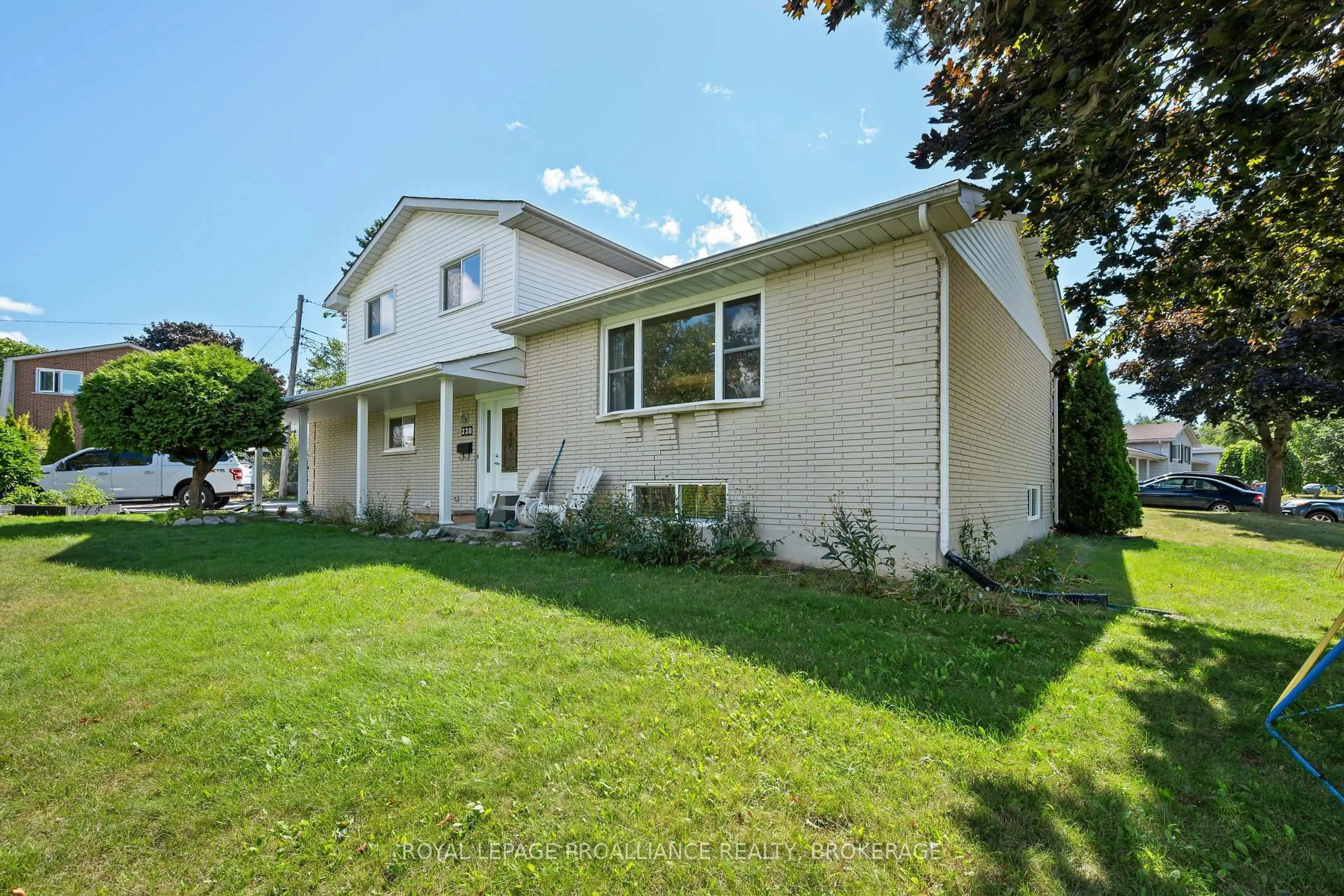 Home with vinyl exterior material, street for 228 Robert Wallace Dr, Kingston Ontario K7M 6C3